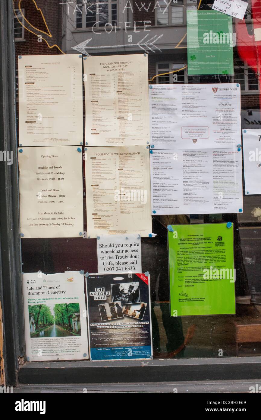 Notice-board in window of Troubadour cafe, Old Brompton Road, Kensington, London Stock Photo
