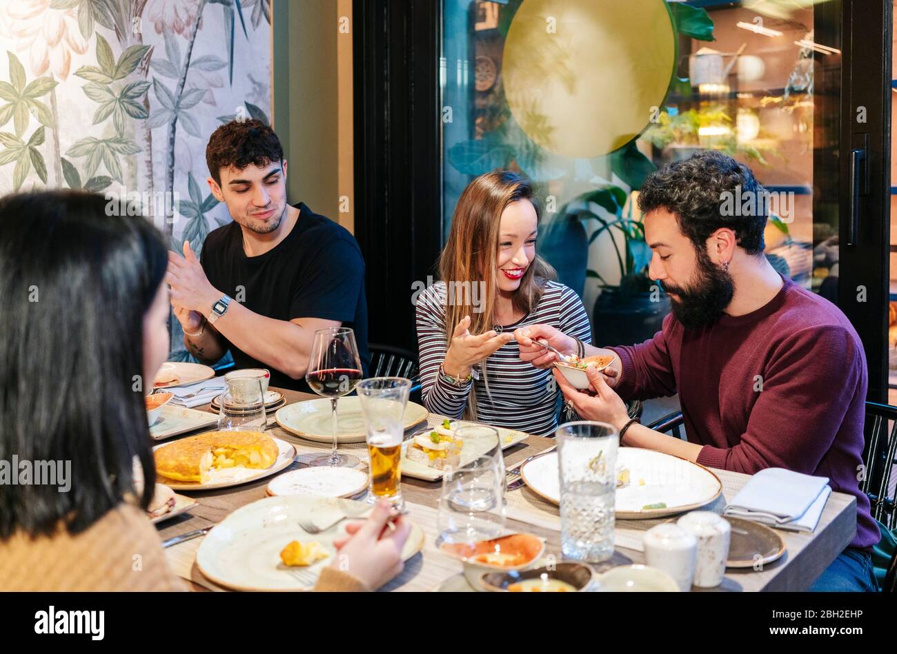 Friends having dinner in a fancy restaurant Stock Photo