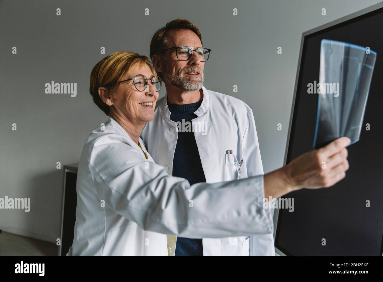 Two doctors discussing x-ray image Stock Photo