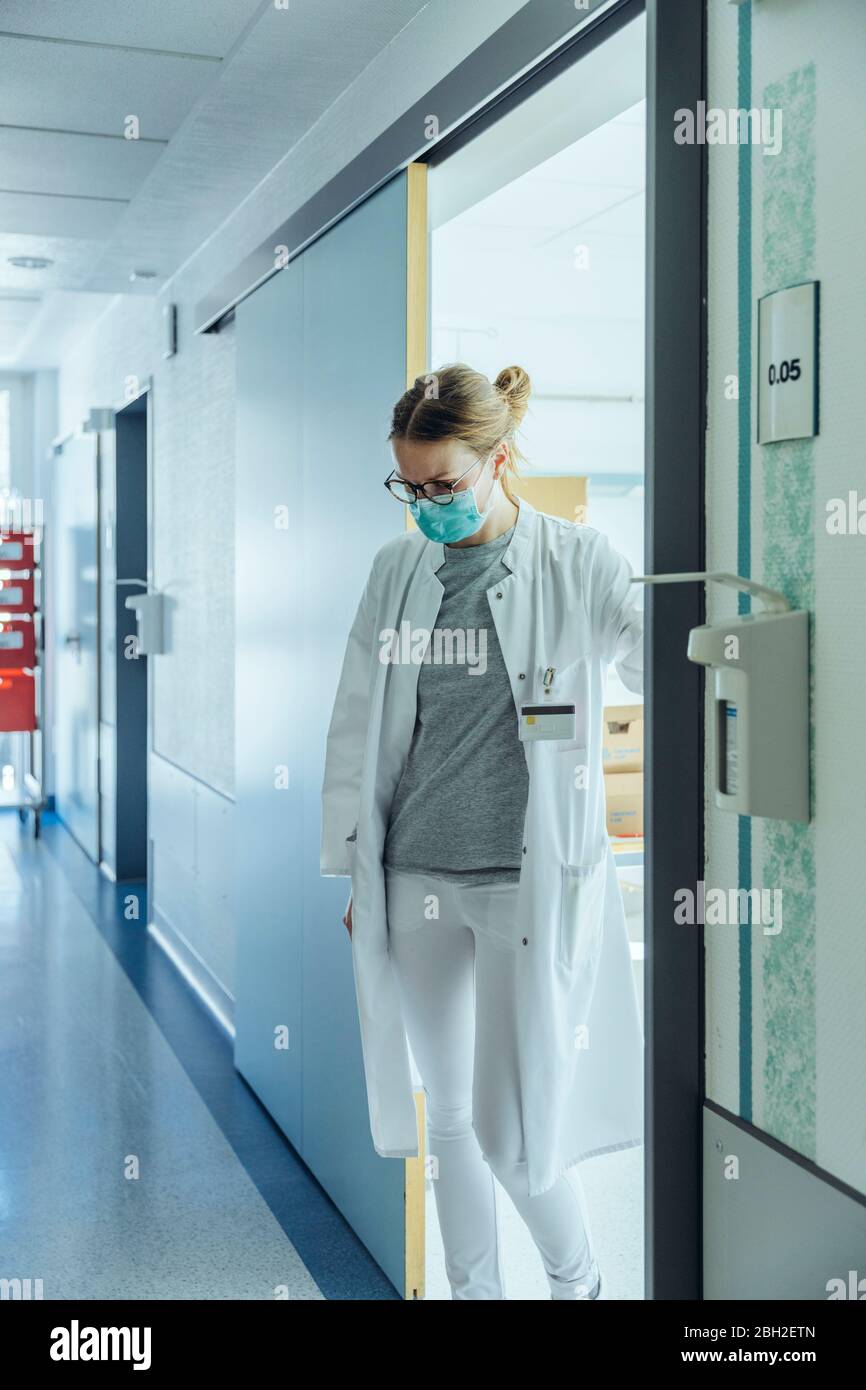Doctor standing on hospital hallway Stock Photo