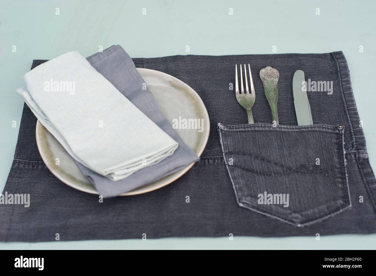 DIY jeans place mat with pocket for cutlery Stock Photo