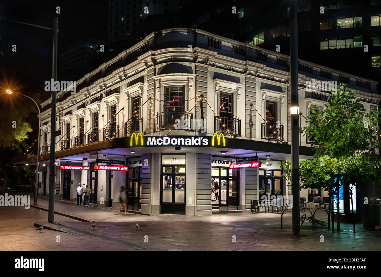 The Mc Donald restaurant at Circular Quay station at night, Sydney. Stock Photo
