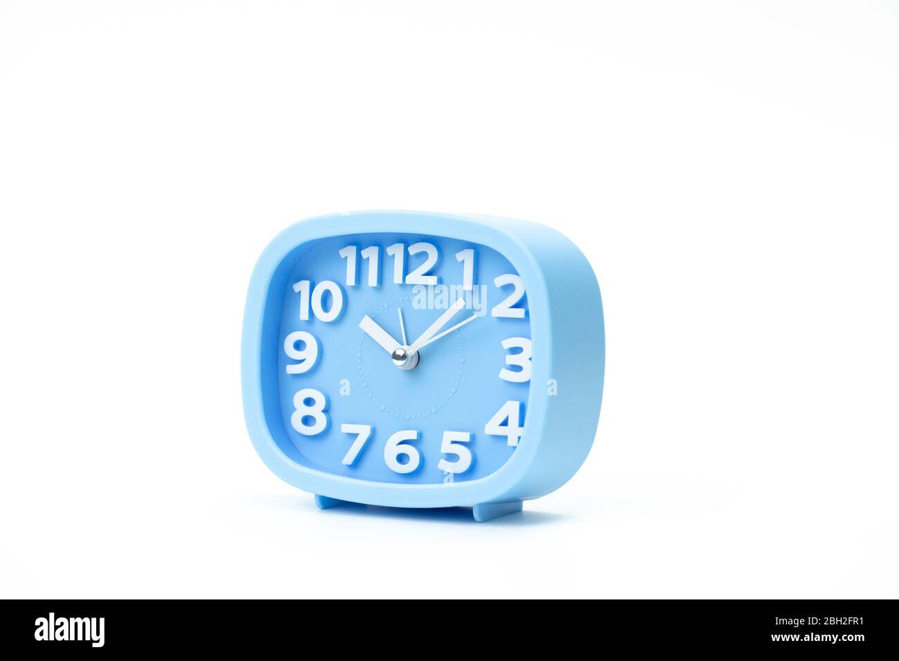 Blue plastic alarm clock time: 10.05 close up isolated on white ...