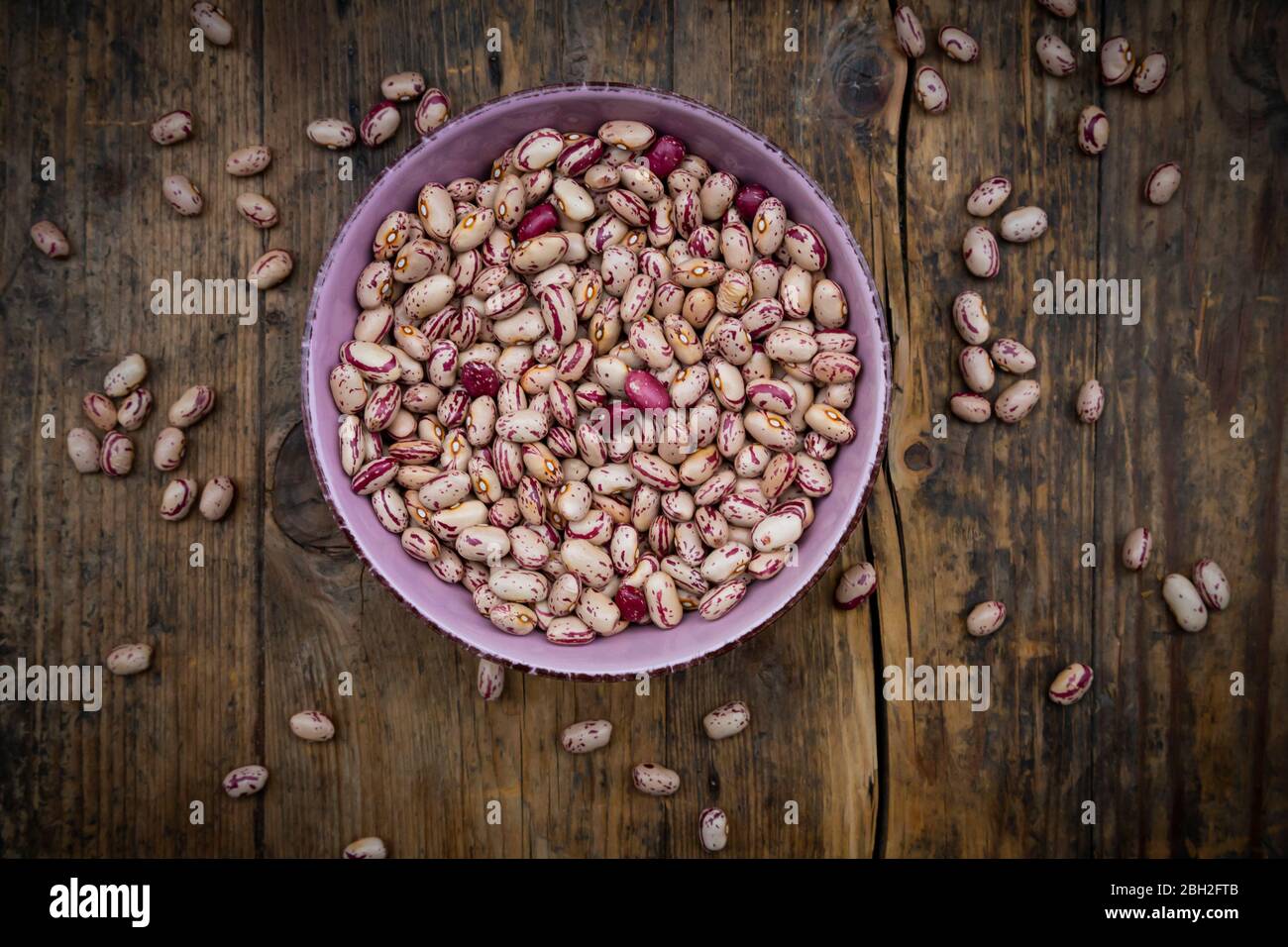 Bowl of dried pinto beans in bowl Stock Photo