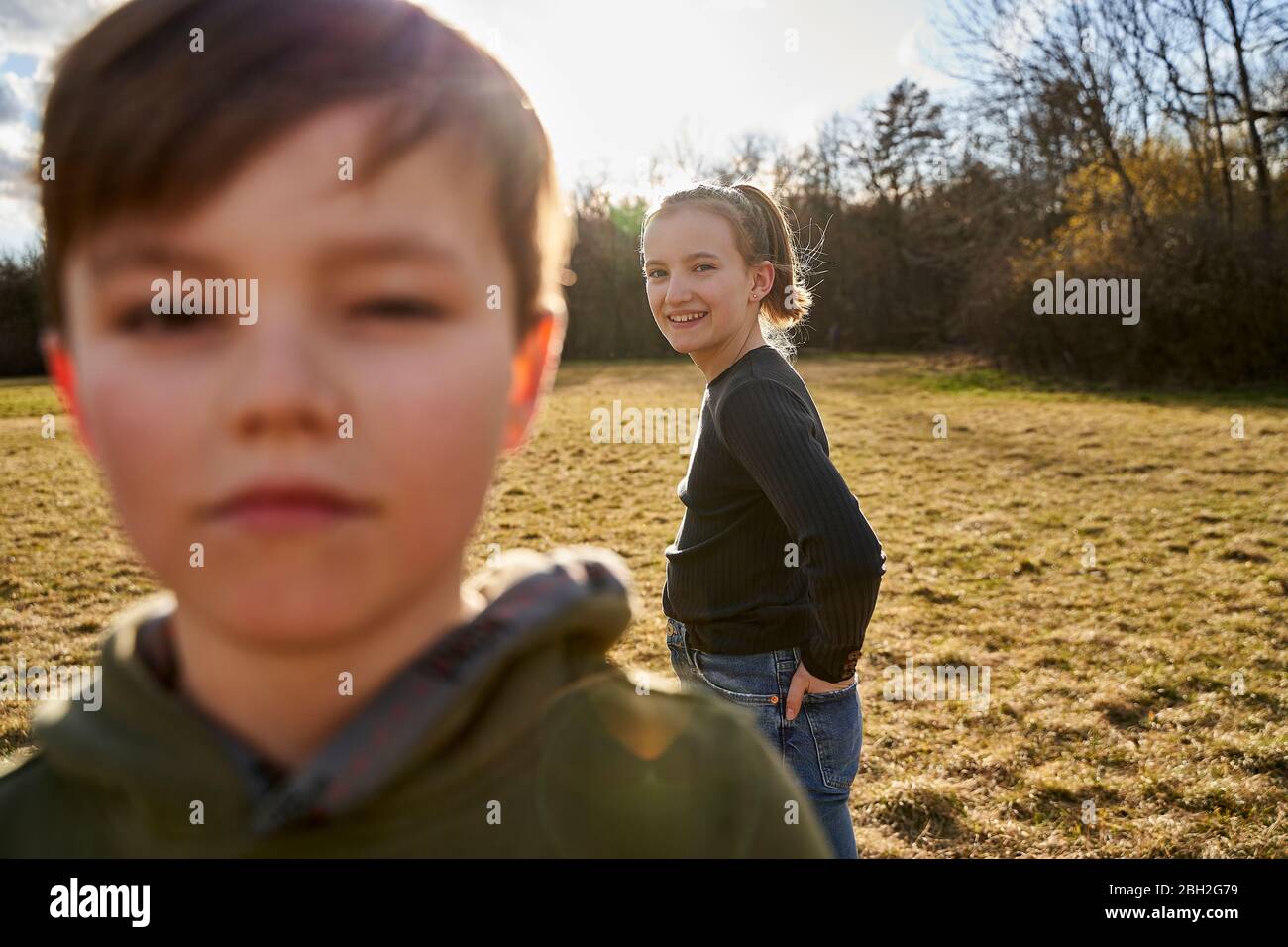 Brother and sister on a meadow Stock Photo - Alamy