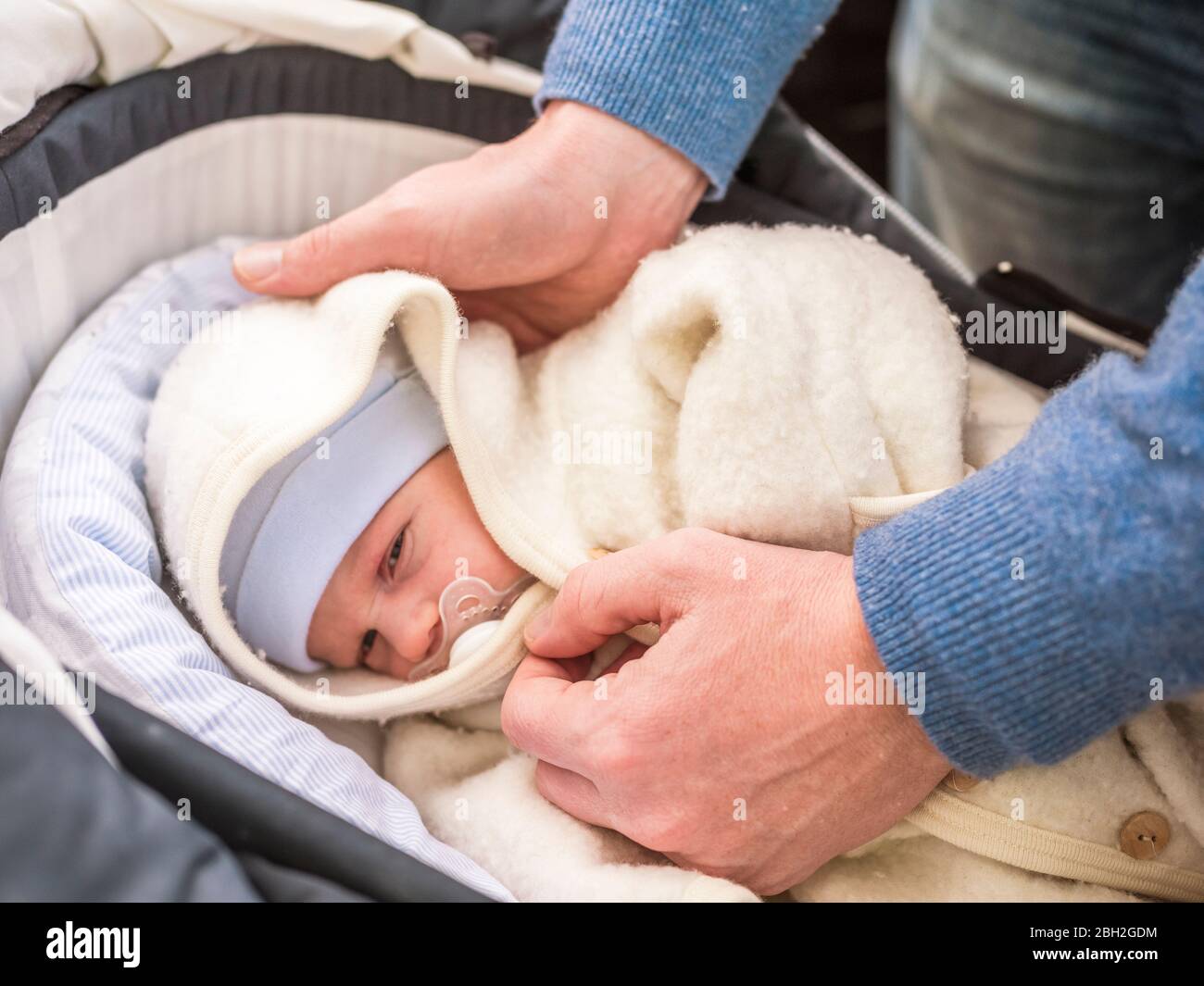 how to put a newborn baby in a pram