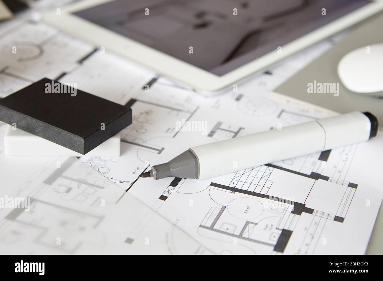 Felt tip pen lying on architectural blueprint Stock Photo