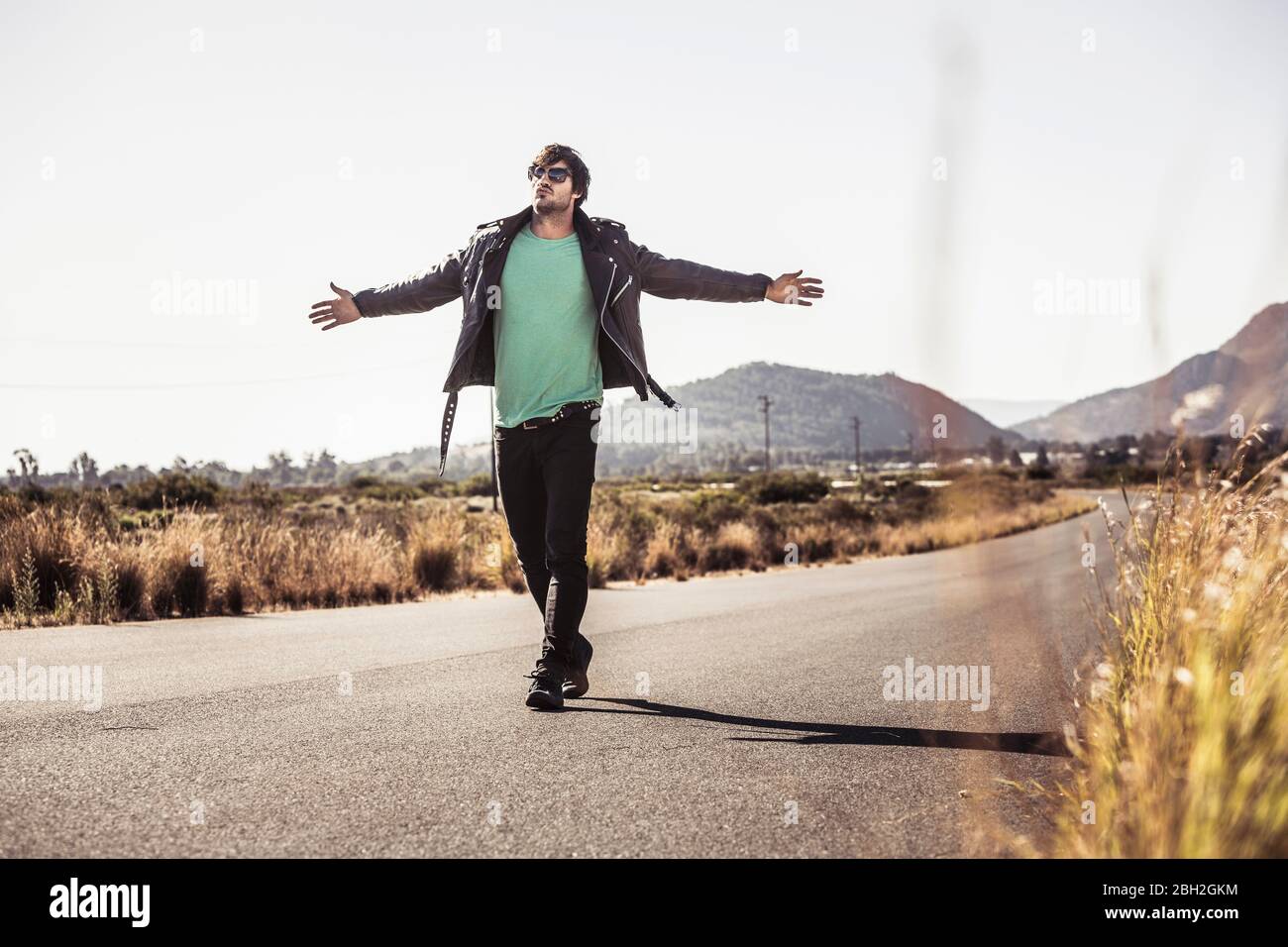 Man walking country road hi-res stock photography and images - Alamy