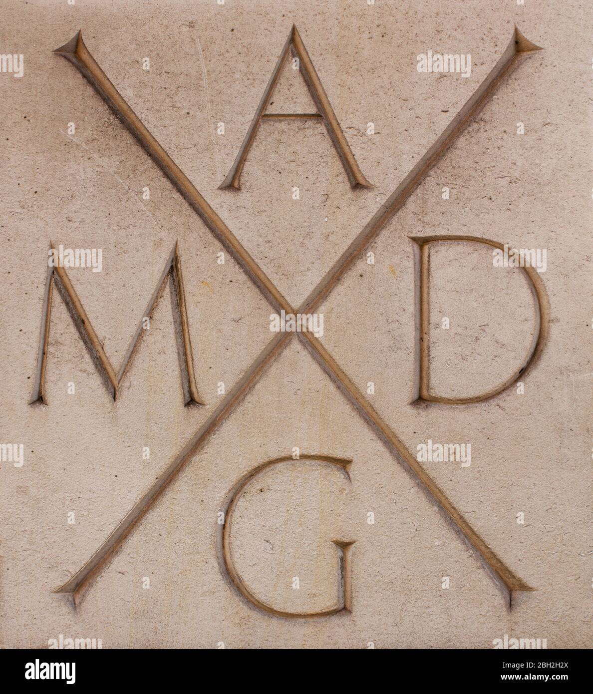 AMDG (Ad Majorem Dei Gloriam) inscription on wall of St Columba's  Kensington, London; Church of Scotland building designed by Sir Edward  Maufe 1955 Stock Photo - Alamy