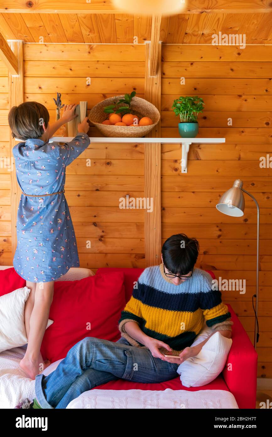 Mother and daughter preparing countryside property to guests