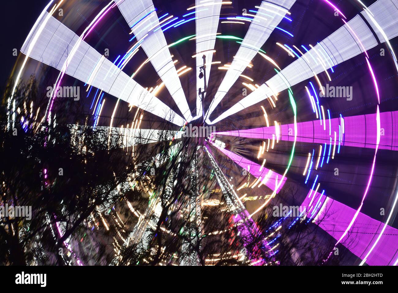 A nighttime view of the Ferris wheel in India with slow sutters speed Stock Photo