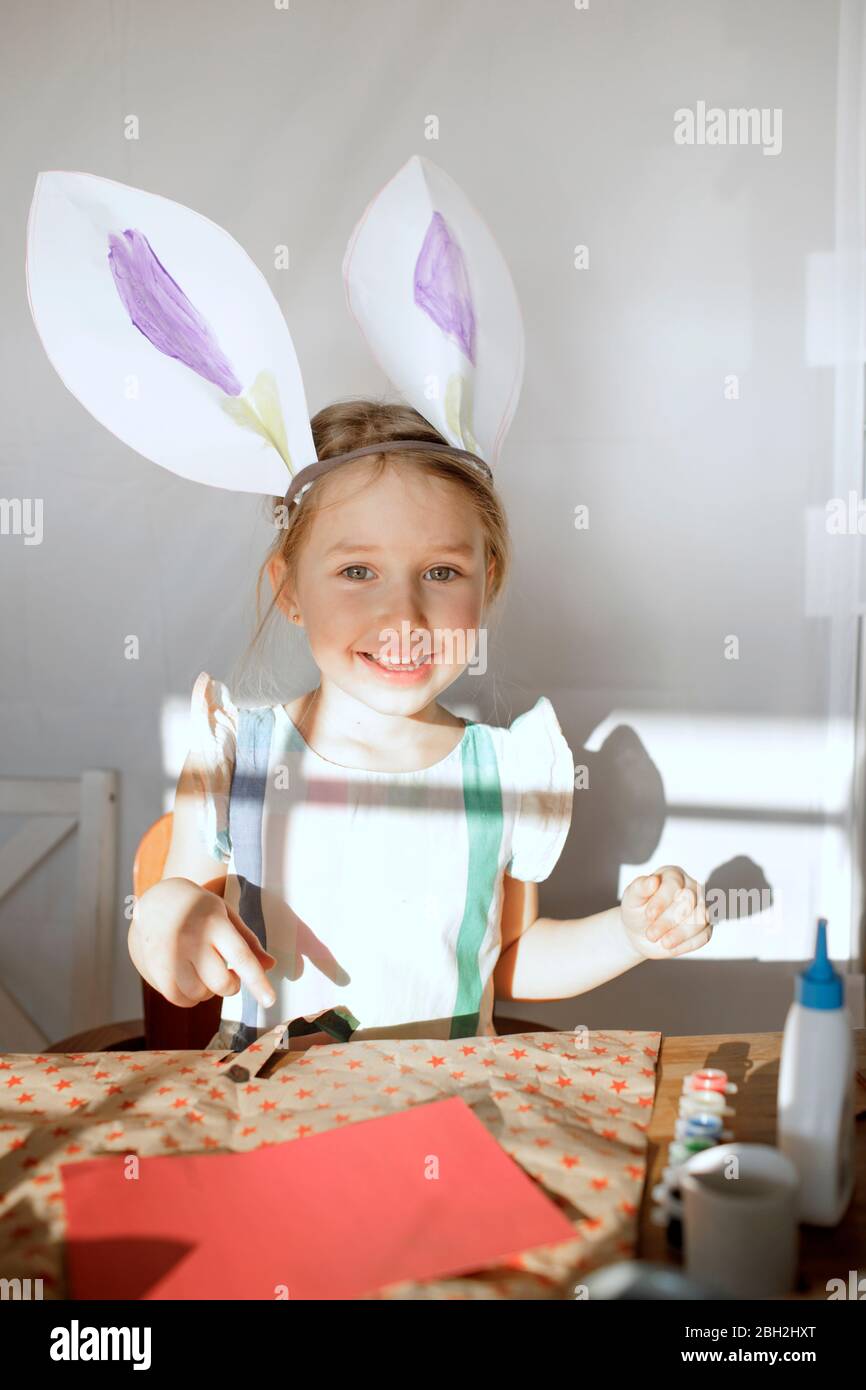 Portrait of little girl with self-made bunny ears Stock Photo