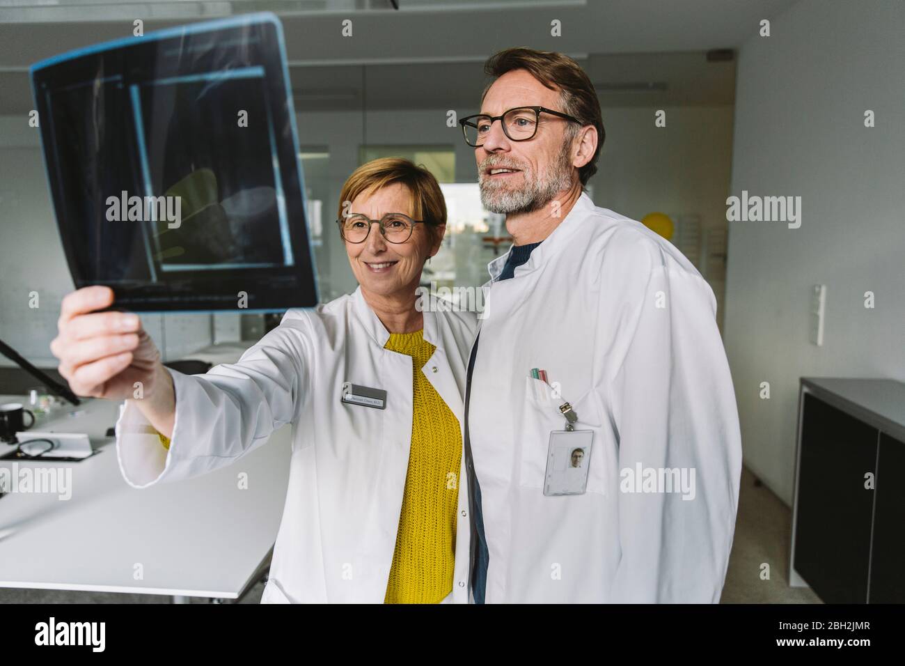 Two doctors discussing x-ray image Stock Photo