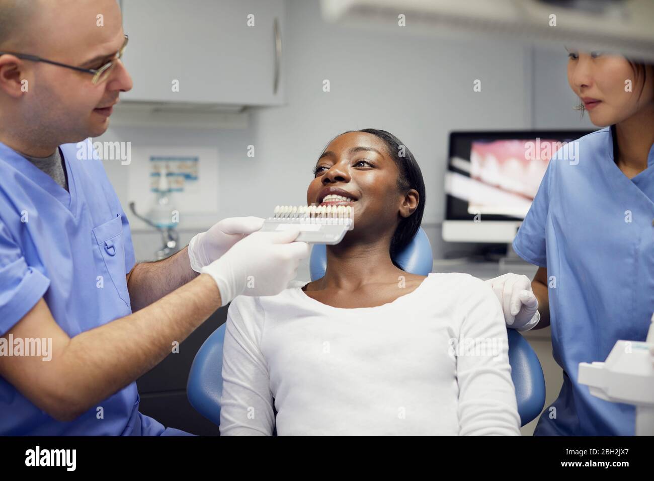 Patient getting dental teeth whitening treatment Stock Photo Alamy