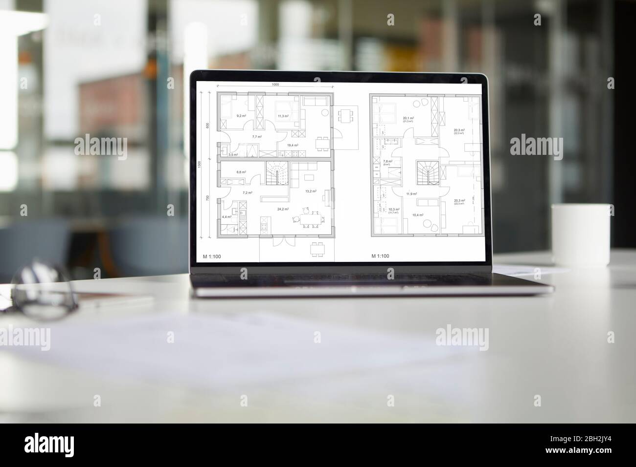 Tablet with floor plan in office Stock Photo