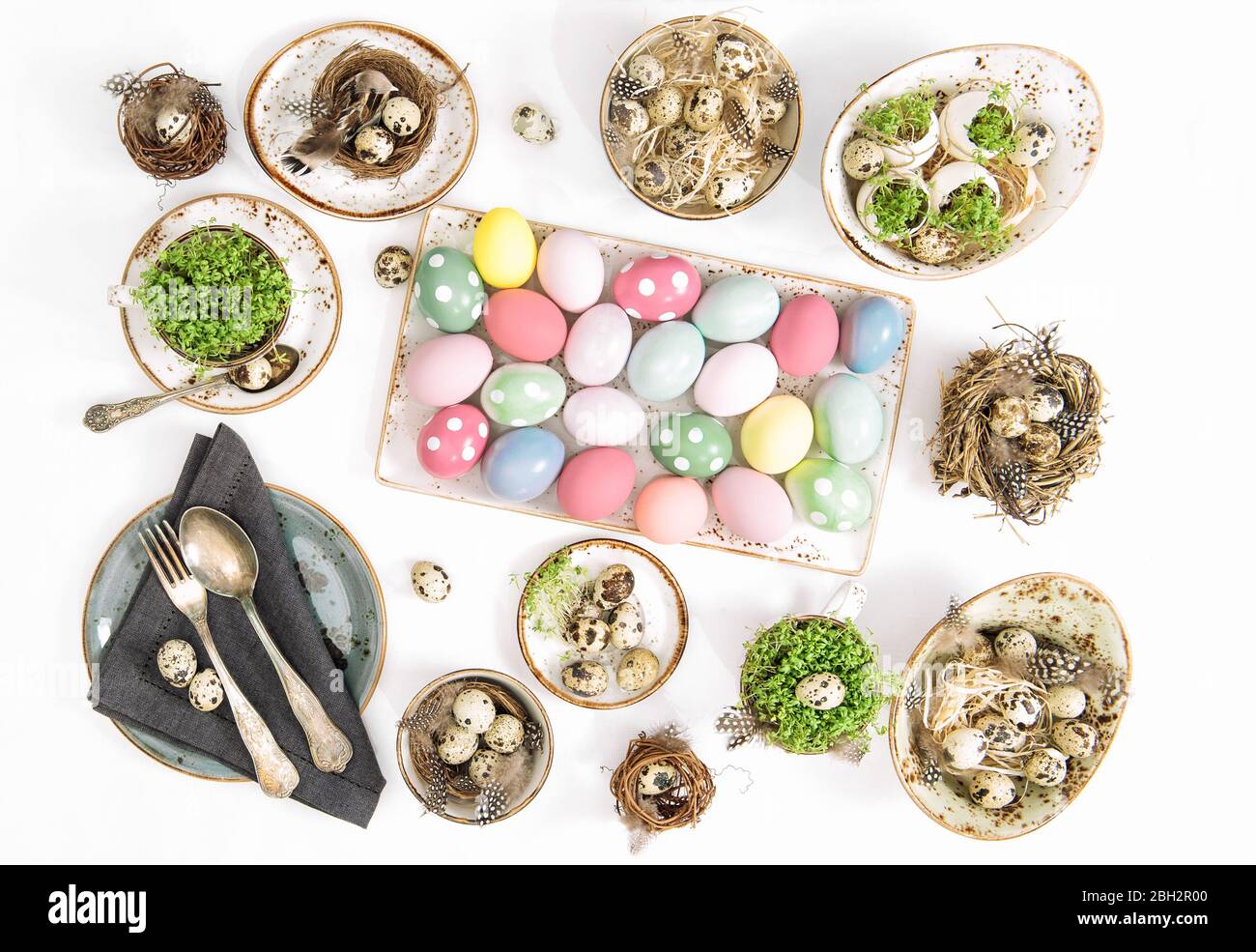 Easter flat lay. Festive table place setting decoration with colored easter eggs Stock Photo