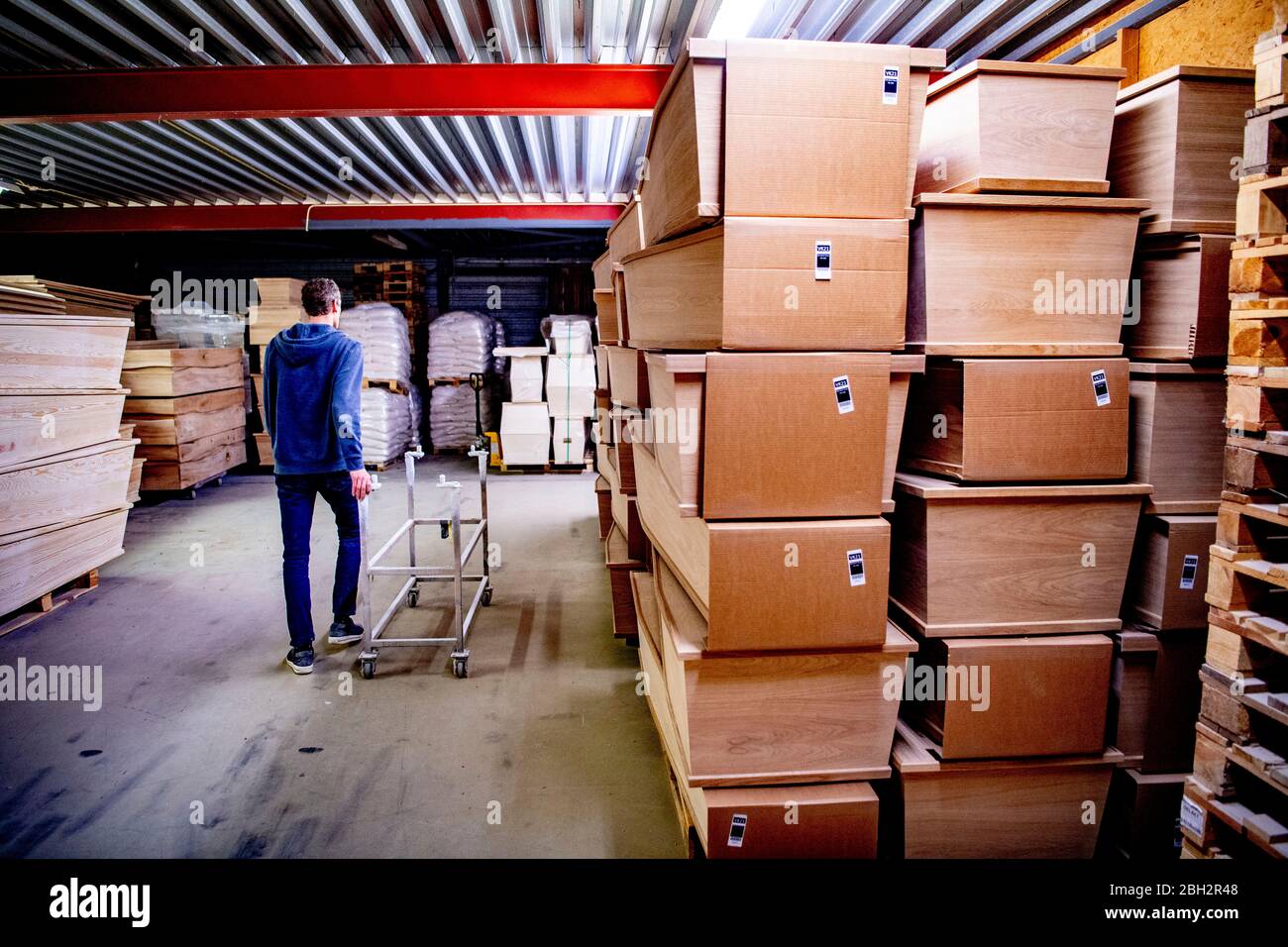 Gendringe, Netherlands. 23rd Apr, 2020. An employee at Tomba coffin maker.As the Coronavirus pandemic ravages Netherlands one coffin design firm south of Gendering has been busy delivering hundreds of caskets per week to double the usual production capacity. Coffin makers and the funeral industry at large are working hard. Credit: SOPA Images Limited/Alamy Live News Stock Photo
