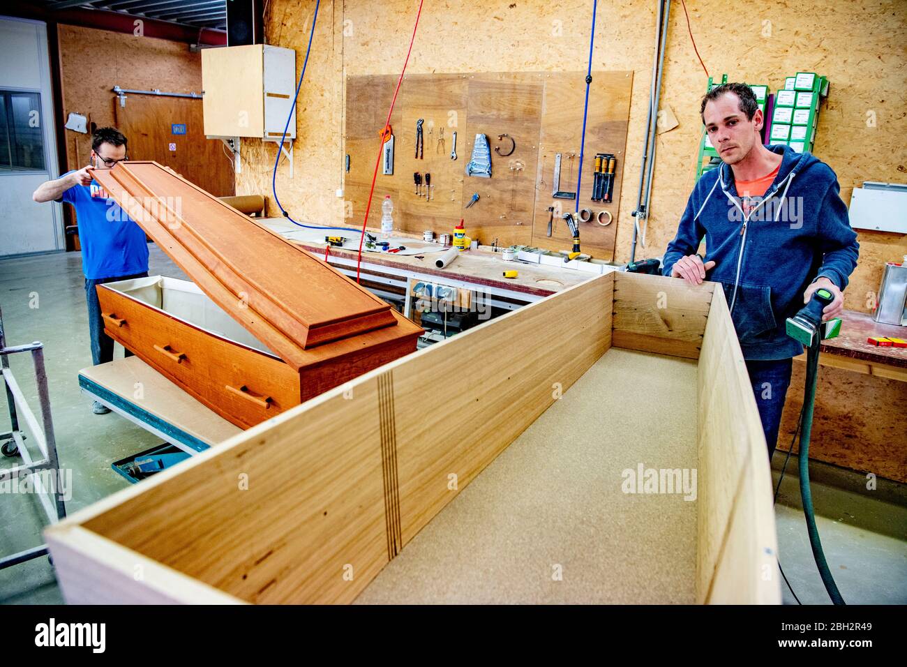 Gendringe, Netherlands. 23rd Apr, 2020. An employee at Tomba coffin maker look on.As the Coronavirus pandemic ravages Netherlands one coffin design firm south of Gendering has been busy delivering hundreds of caskets per week to double the usual production capacity. Coffin makers and the funeral industry at large are working hard. Credit: SOPA Images Limited/Alamy Live News Stock Photo