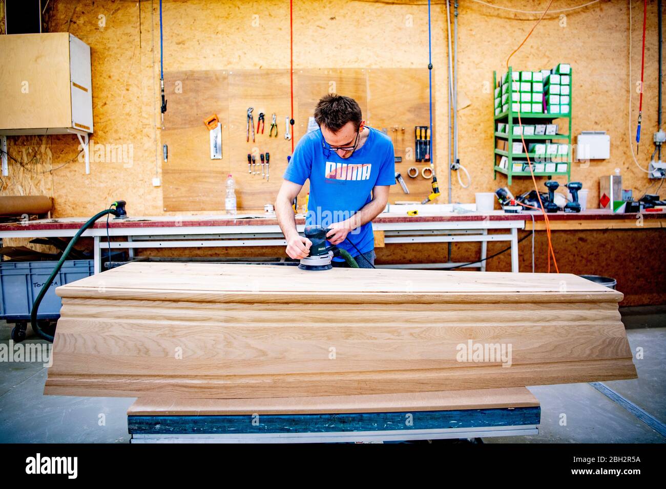 Gendringe, Netherlands. 23rd Apr, 2020. An employee making a casket at Tomba coffin maker.As the Coronavirus pandemic ravages Netherlands one coffin design firm south of Gendering has been busy delivering hundreds of caskets per week to double the usual production capacity. Coffin makers and the funeral industry at large are working hard. Credit: SOPA Images Limited/Alamy Live News Stock Photo
