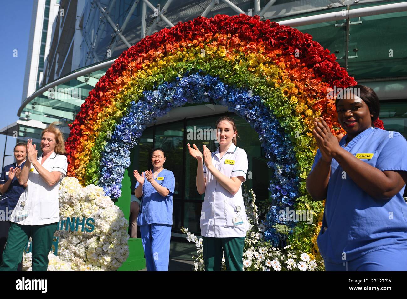 Nurses and occupational therapists help to unveil a rainbow floral displays at University College Hospital at Euston Road, in London to thank the public for their support during the ongoing pandemic. Stock Photo