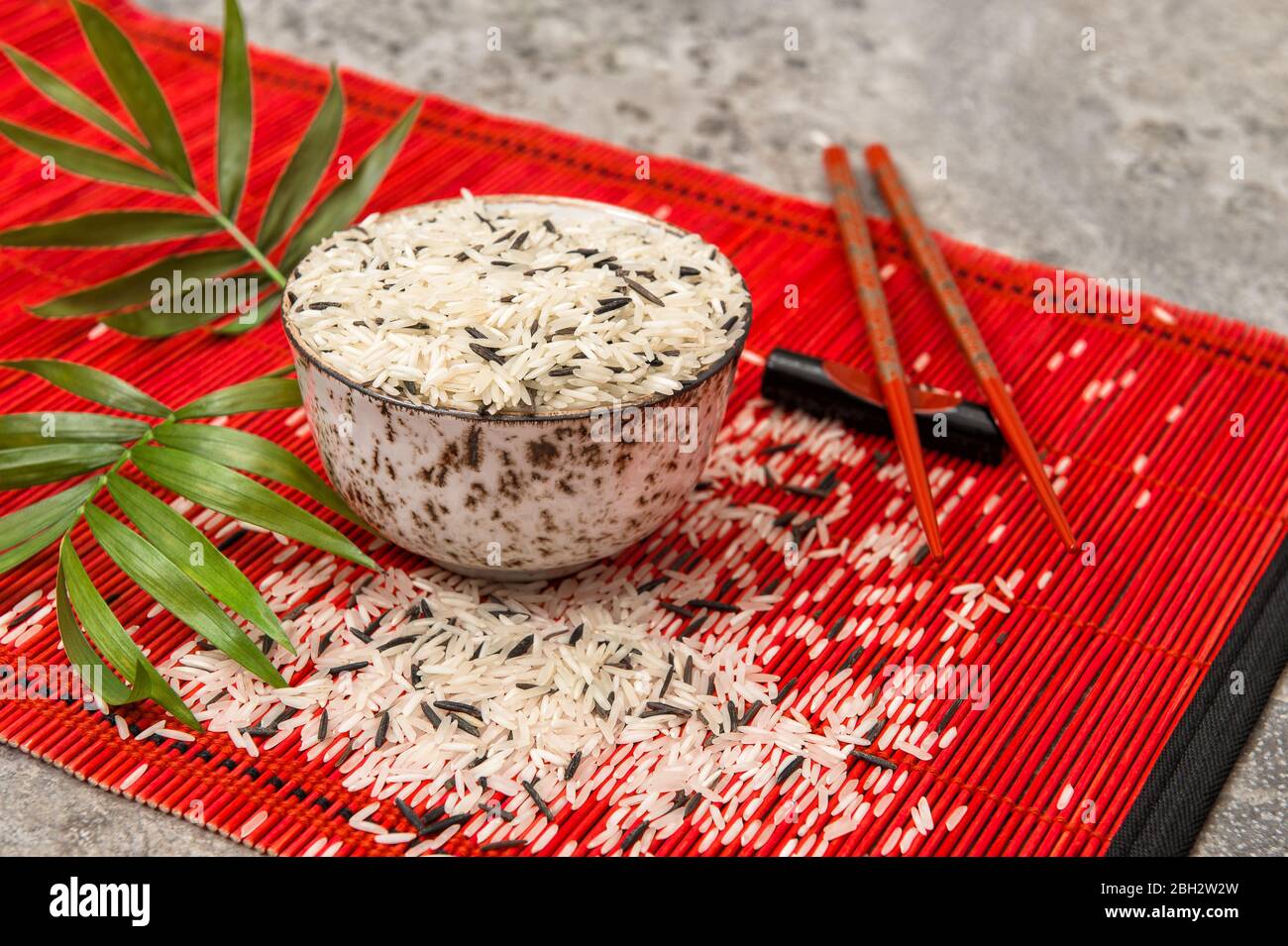 Rice bowl with chopsticks. Asian food background Stock Photo