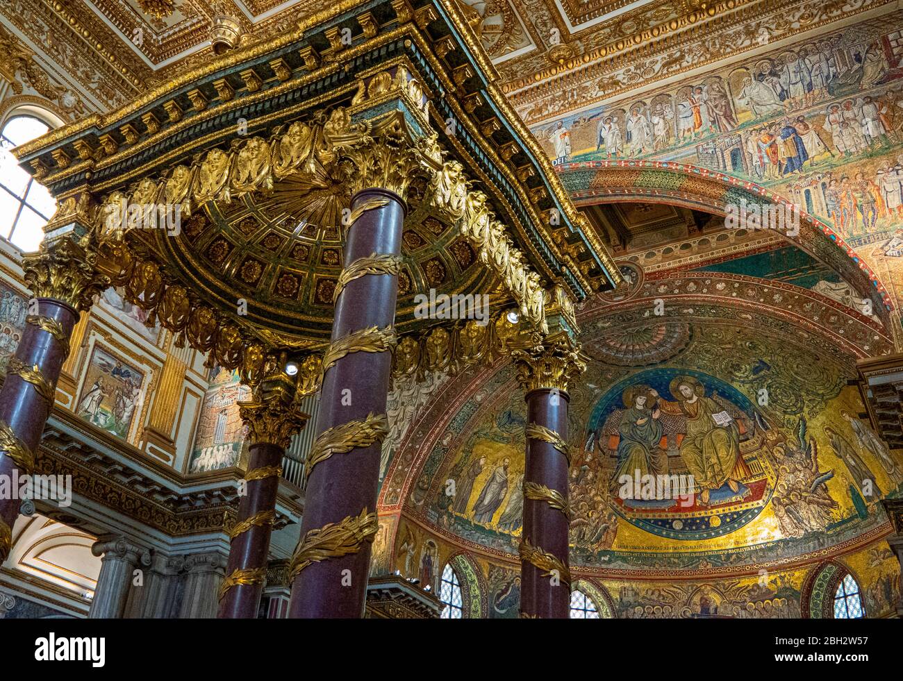 Rome, Italy - July 20, 2018: The canopyt over the main altar,  with the Coronation mosaic in the background, of he Santa Maria Maggiore Basilica Stock Photo