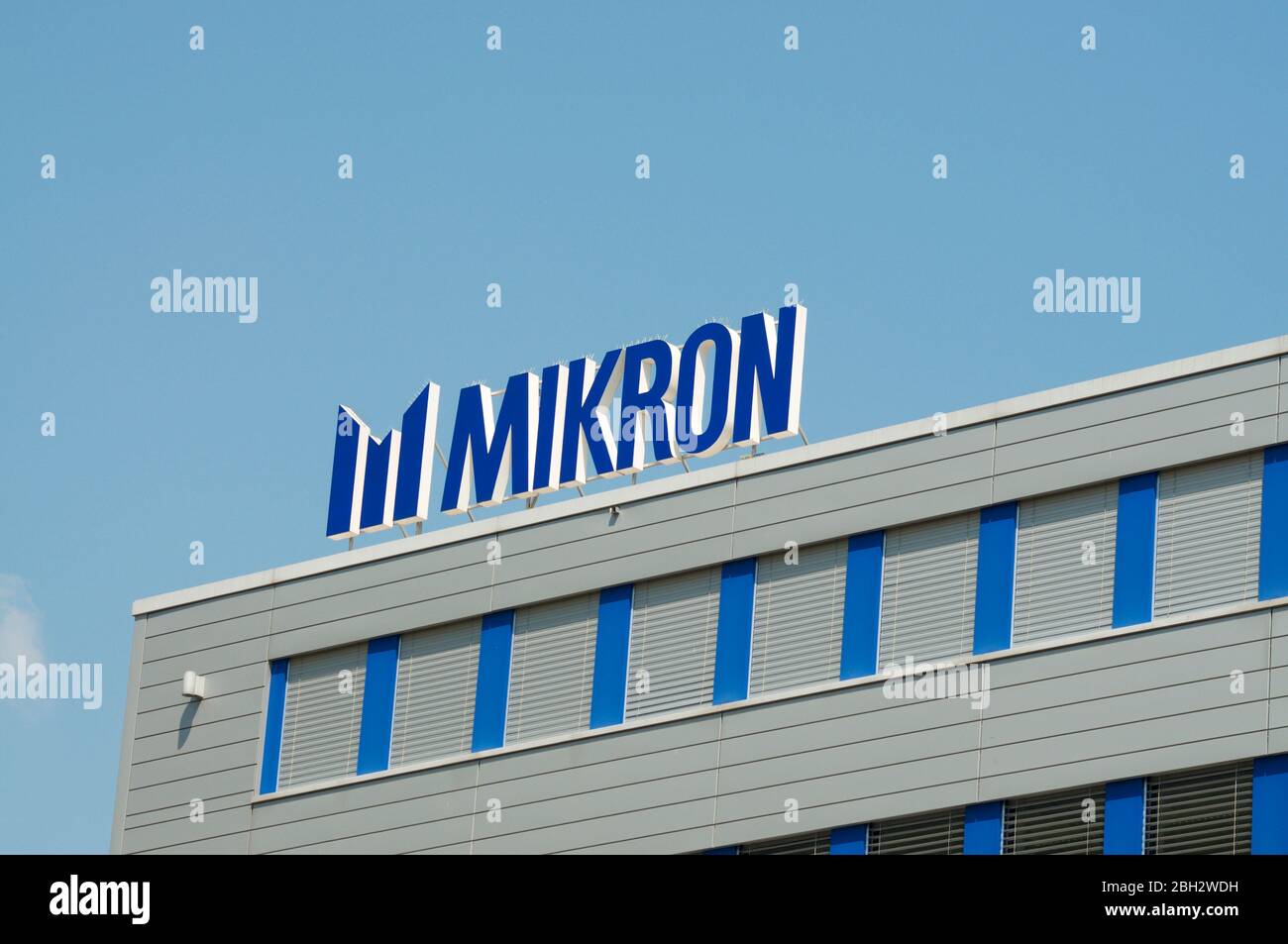 Agno, Ticino, Switzerland - 23rd April 2020 : Logo of Mikron Group company. Mikron develops, produces highly precise, productive and adaptable automat Stock Photo