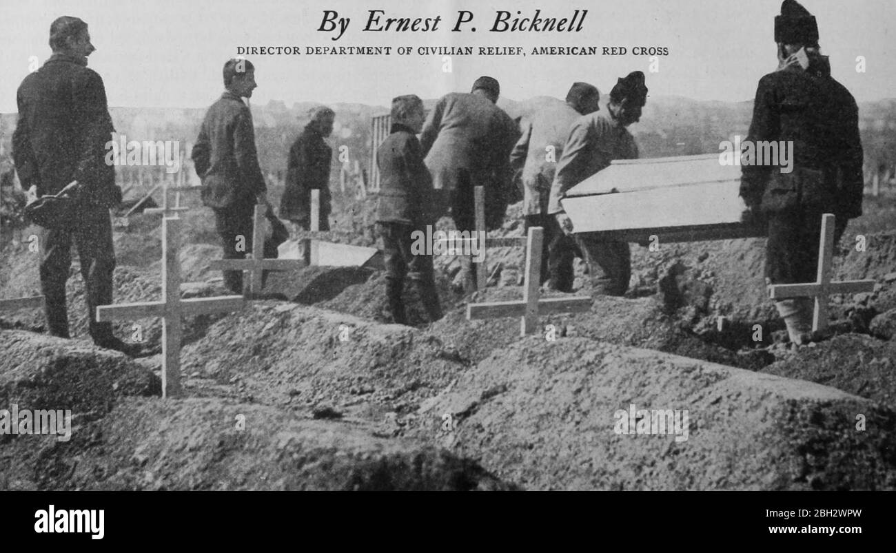 Image from the journal 'The Survey Vol, 1917. XXXVII, October 1916 - March 1917' by the Survey Associates Inc, featuring a group of men burying deceased typhus patients in Serbia, Europe. Courtesy Internet Archive. () Stock Photo