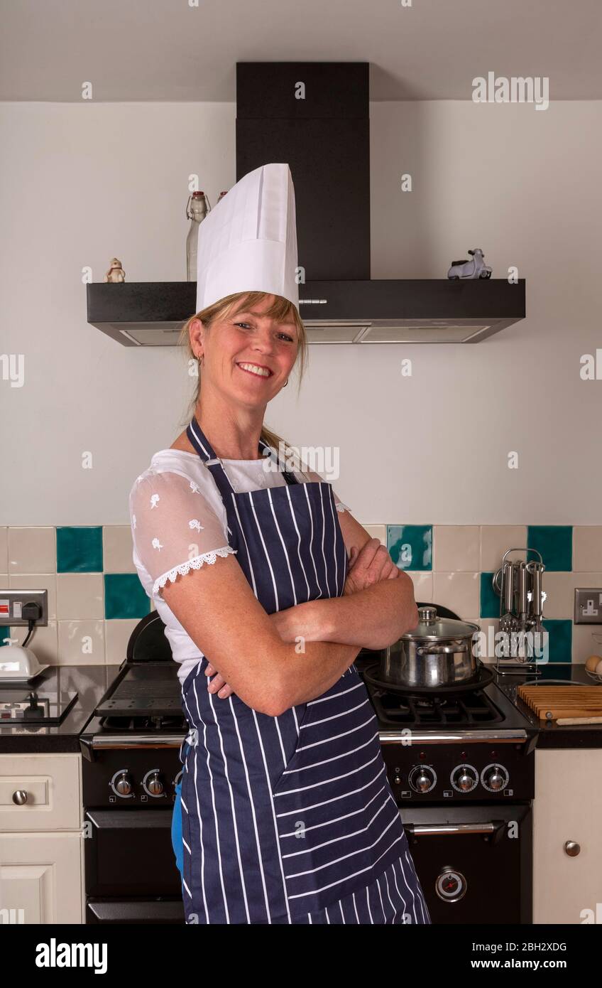 Blonde woman chef in apron hires stock photography and images Alamy