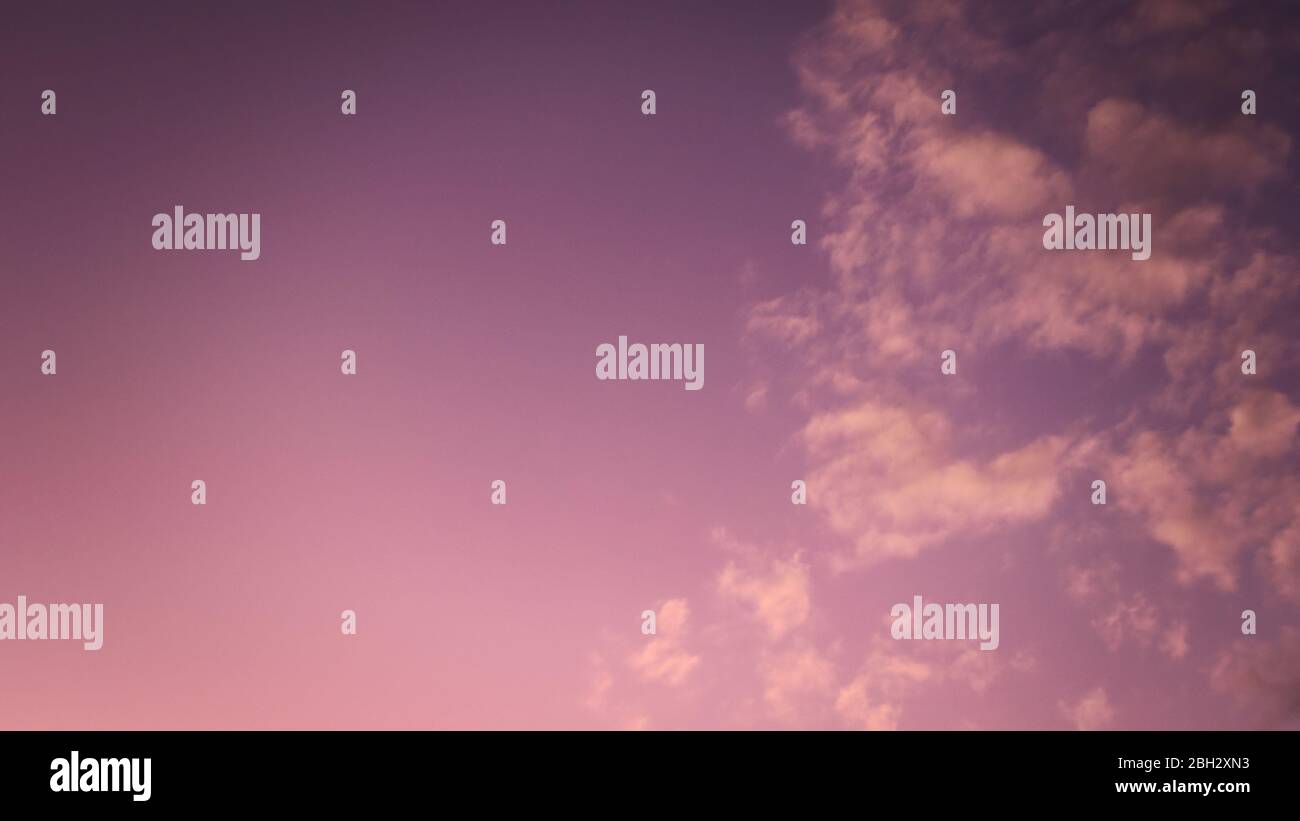 Colorful twilight summer sky with sparse, light clouds. Stock Photo
