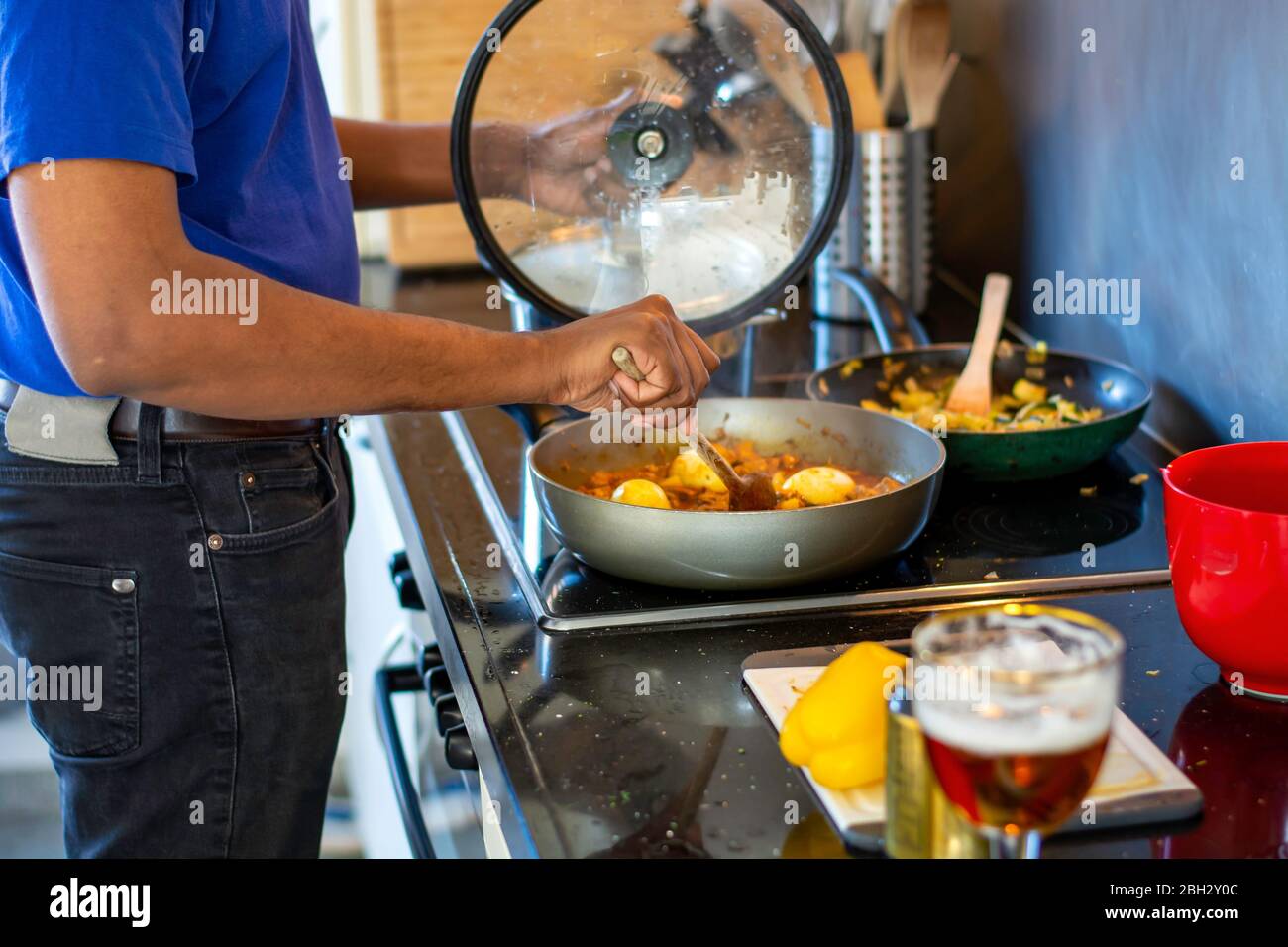 Dirty cast iron skillet being prepared for cleaning with coarse salt, brush,  scraper and dish towel on a counter Stock Photo - Alamy