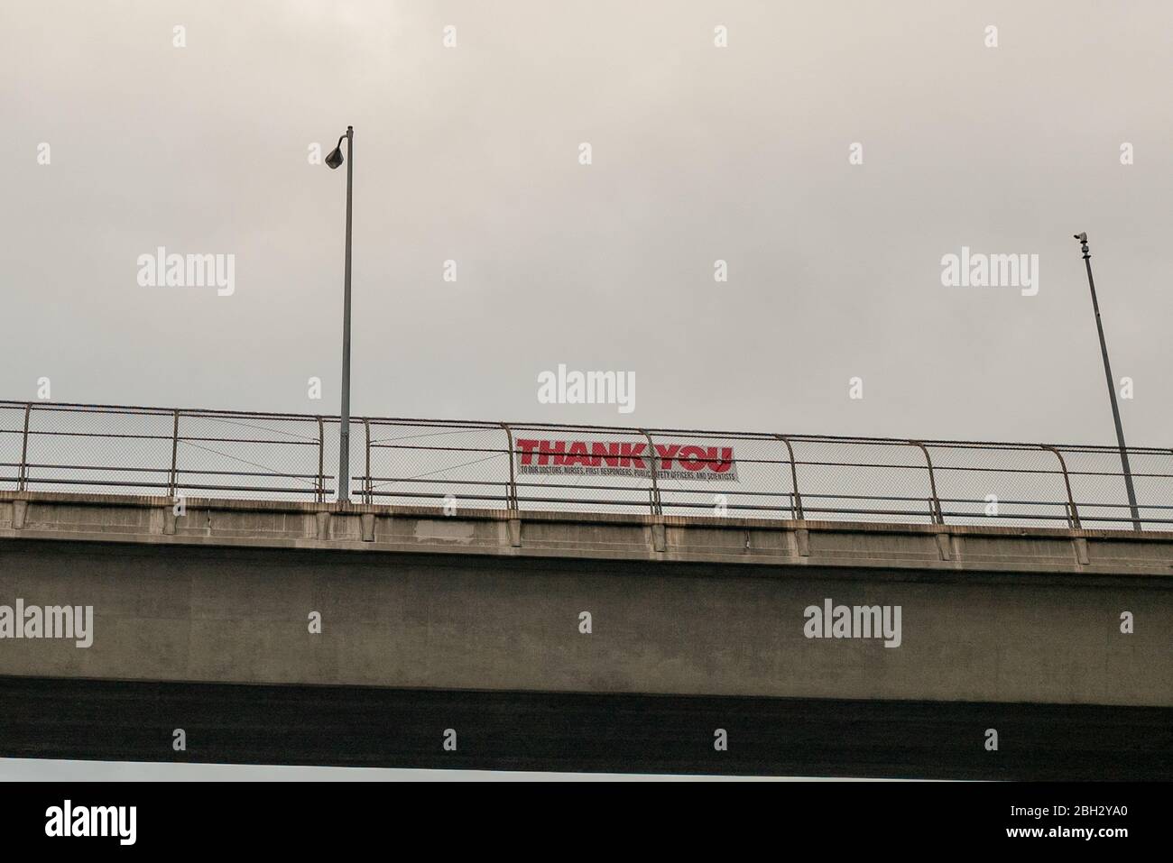 A sign has been placed on a highway overpass thanking first responders and scientists during an outbreak of the COVID-19 coronavirus, Walnut Creek, California, March 30, 2020. () Stock Photo