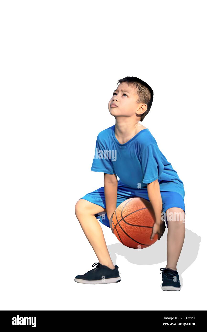 Isolated Asian boy holding a basketball on a white background with clipping path. Stock Photo