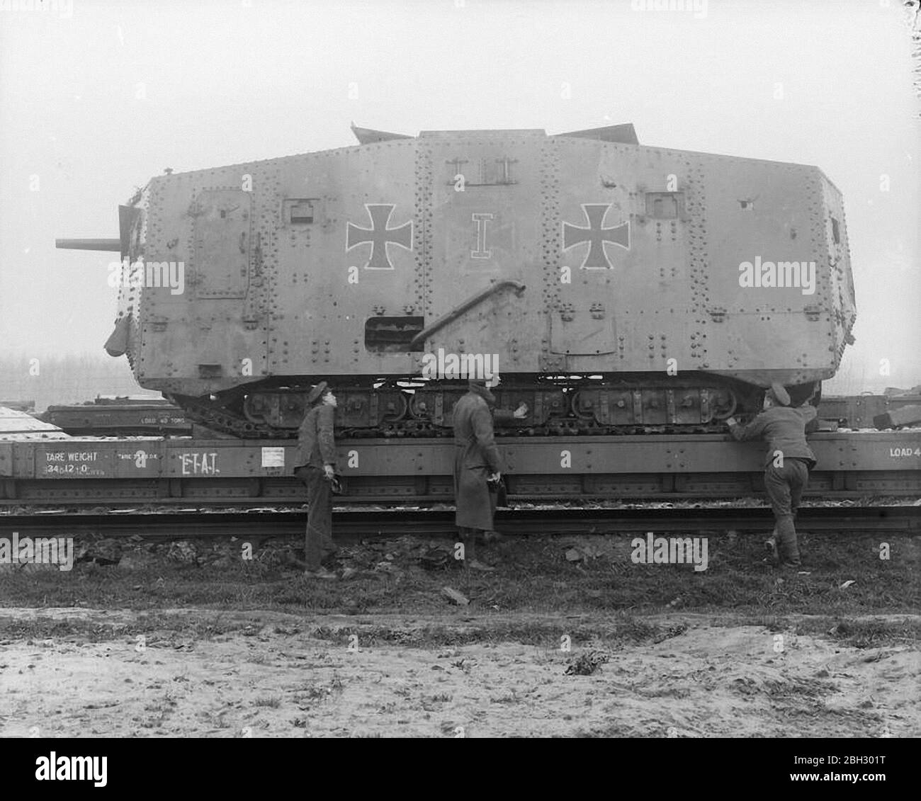 he A7V was a heavy tank introduced by Germany in 1918 during World War I. The A7V was 7.34 m (24 ft 1 in) long and 3 m (9 ft 10 in) wide, and the maximum height was 3.3 m (10 ft 10 in). The crew officially consisted of at least 17 soldiers and one officer: commander (officer, typically a lieutenant), driver, mechanic, mechanic/signaller, 12 infantrymen (six machine gunners, six loaders), and two artillerymen (main gunner and loader). A7Vs often went into action with as many as 25 men on boardTHE BRITISH ARMY ON THE WESTERN FRONT, 1914-1918 (Q 9775) Captured German A7V tank on a railway carriag Stock Photo