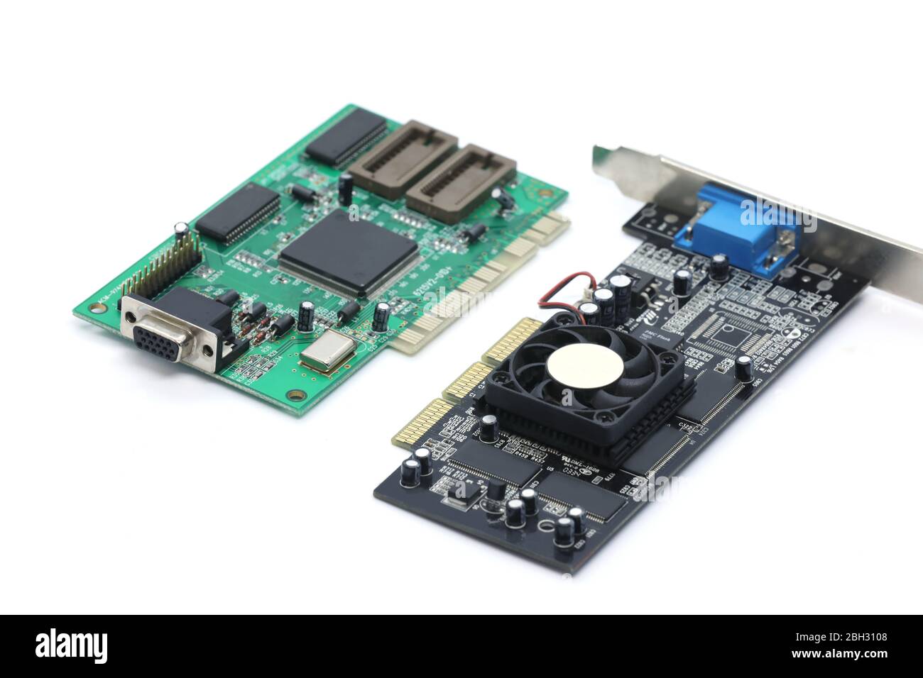 green computer chips, old video card isolated on a black background. Inside the computer. Stock Photo