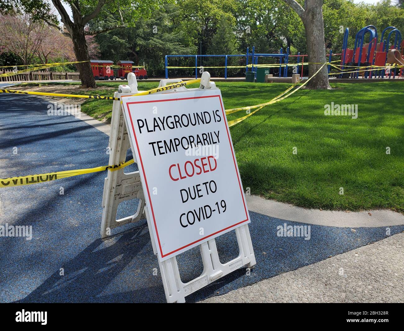Caution tape and signs are visible at a closed playground during an outbreak of COVID-19 coronavirus in Walnut Creek, California, April 8, 2020. () Stock Photo