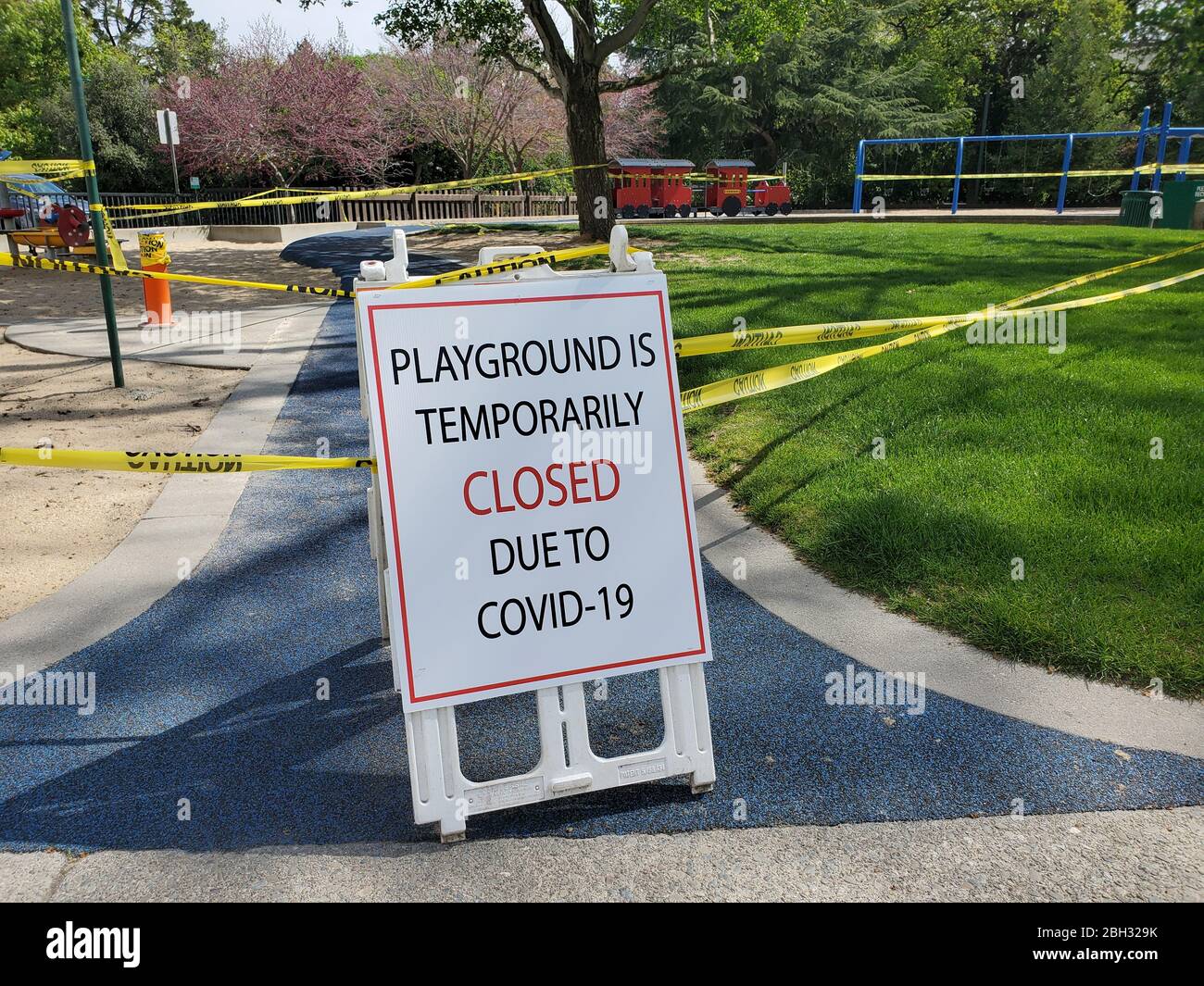 Caution tape and signs are visible at a closed playground during an outbreak of COVID-19 coronavirus in Walnut Creek, California, April 8, 2020. () Stock Photo