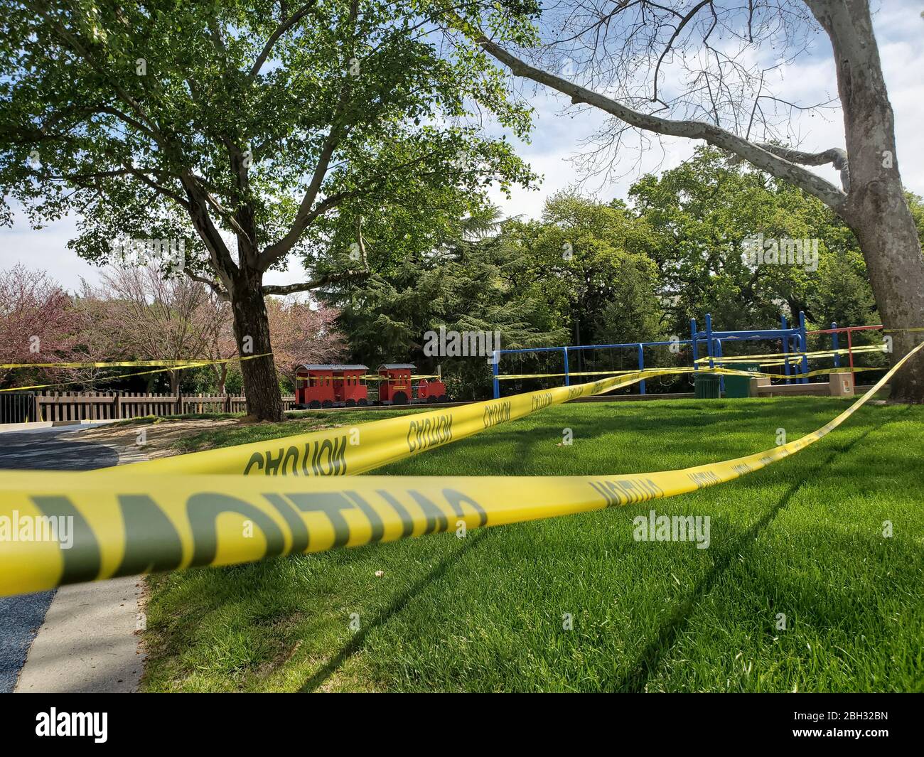 Caution tape and signs are visible at a closed playground during an outbreak of COVID-19 coronavirus in Walnut Creek, California, April 8, 2020. () Stock Photo