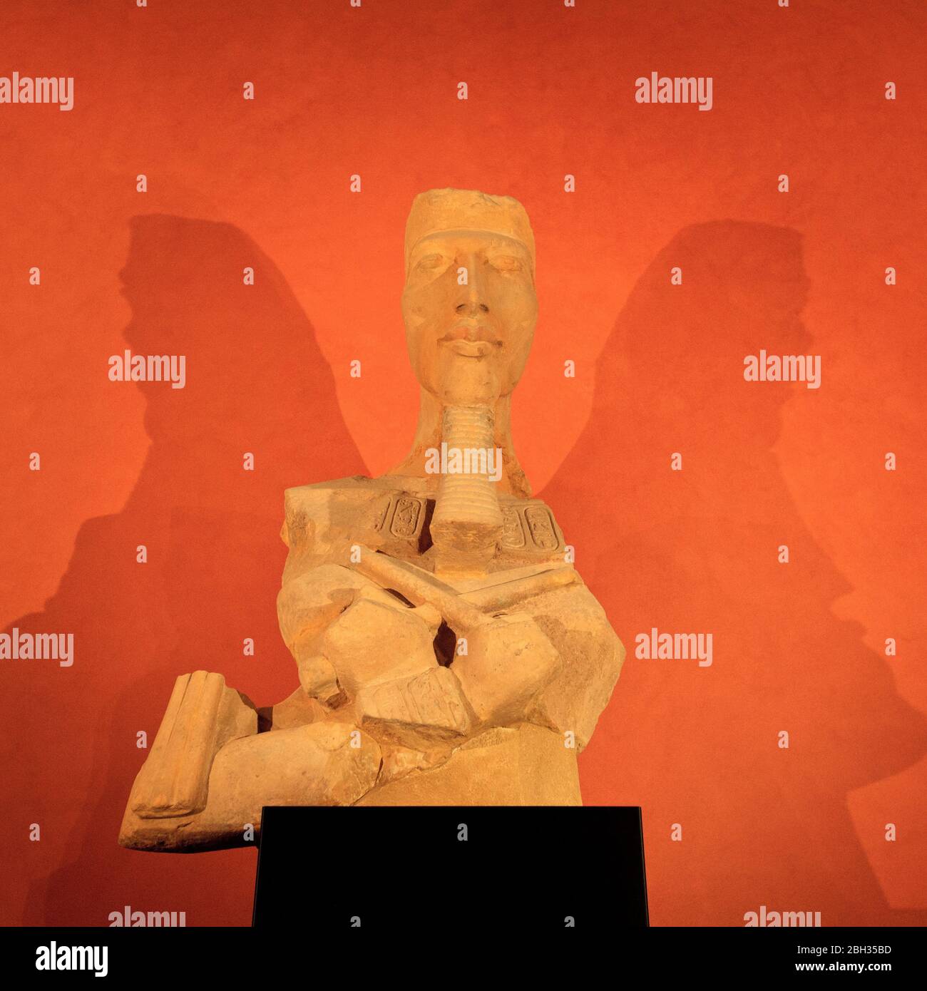 A fragment of an Egyptian statue of Akhenaton, Louvre Museum. Paris Stock Photo