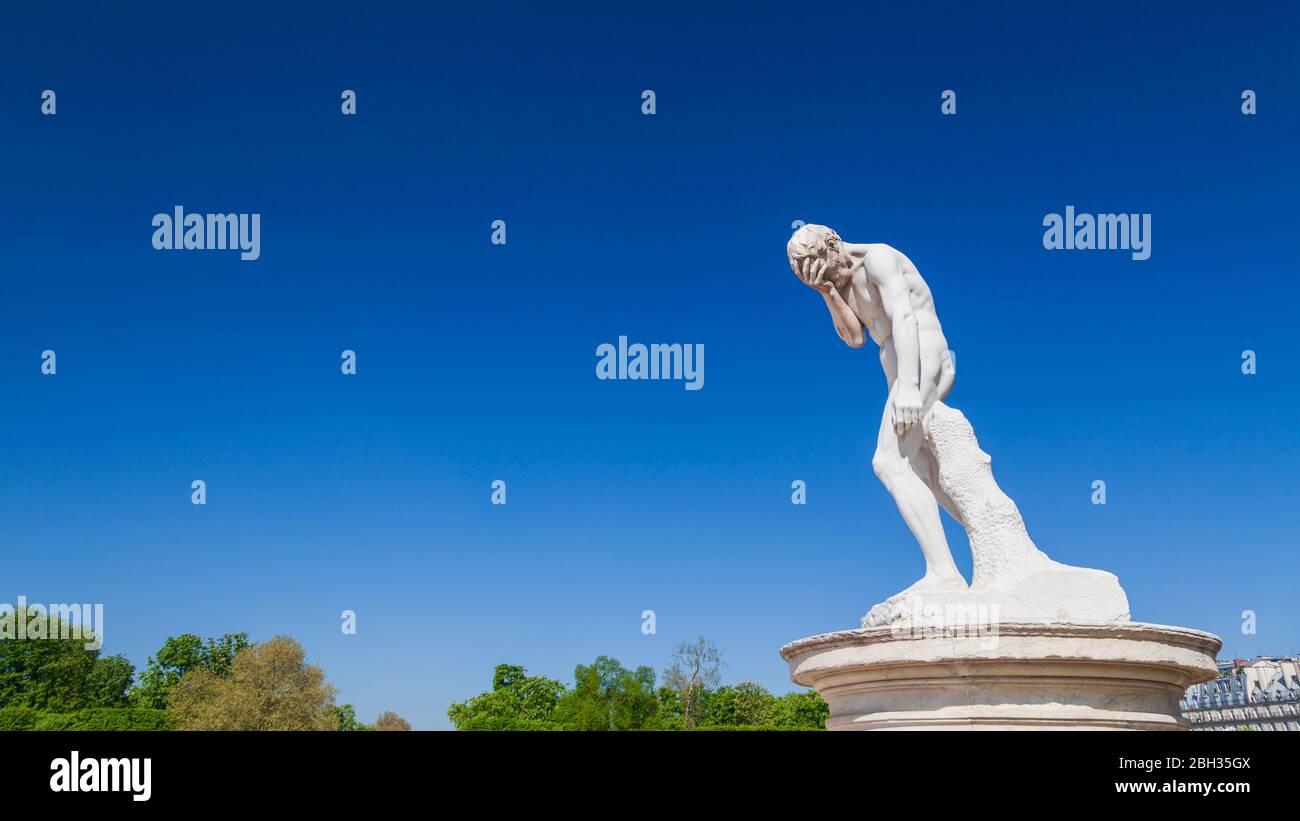 A statue of Cain after killing his brother Abel by Henri Vidal in the Tuileries Garden, Paris Stock Photo