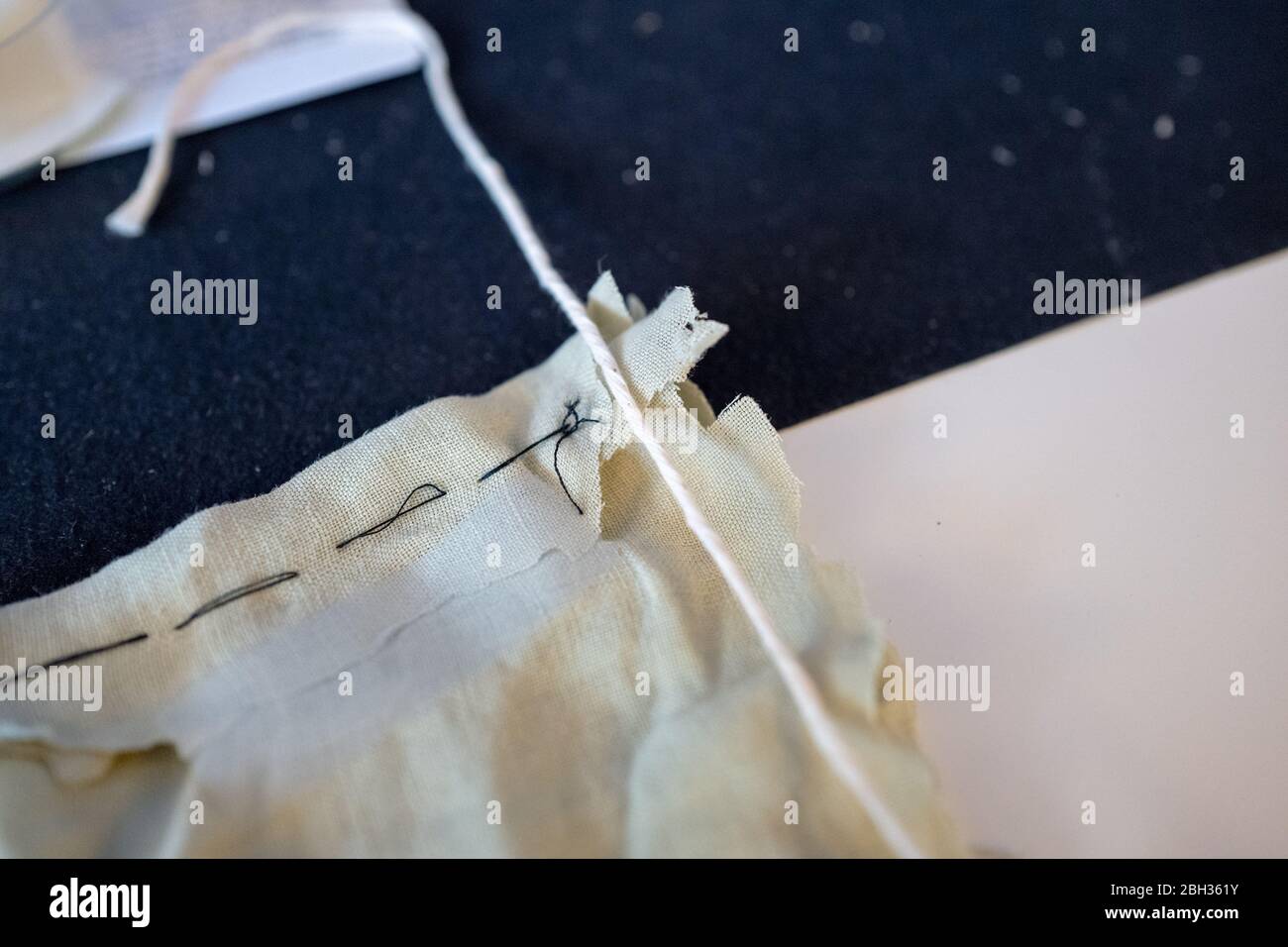 Construction of a homemade cloth face mask, based on the guidelines and sewing directions provided by the Centers for Disease Control and Prevention (CDC), during an outbreak of the COVID-19 coronavirus, San Ramon, California, April 17, 2020. () Stock Photo