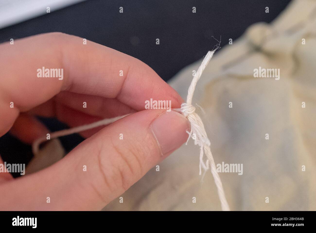 Construction of a homemade cloth face mask, based on the guidelines and sewing directions provided by the Centers for Disease Control and Prevention (CDC), during an outbreak of the COVID-19 coronavirus, San Ramon, California, April 17, 2020. () Stock Photo