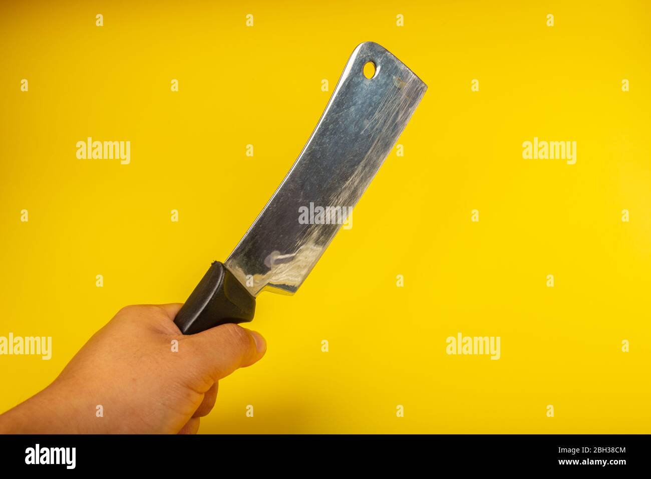 Butcher knife with wooden handle on yellow background Stock Photo Alamy