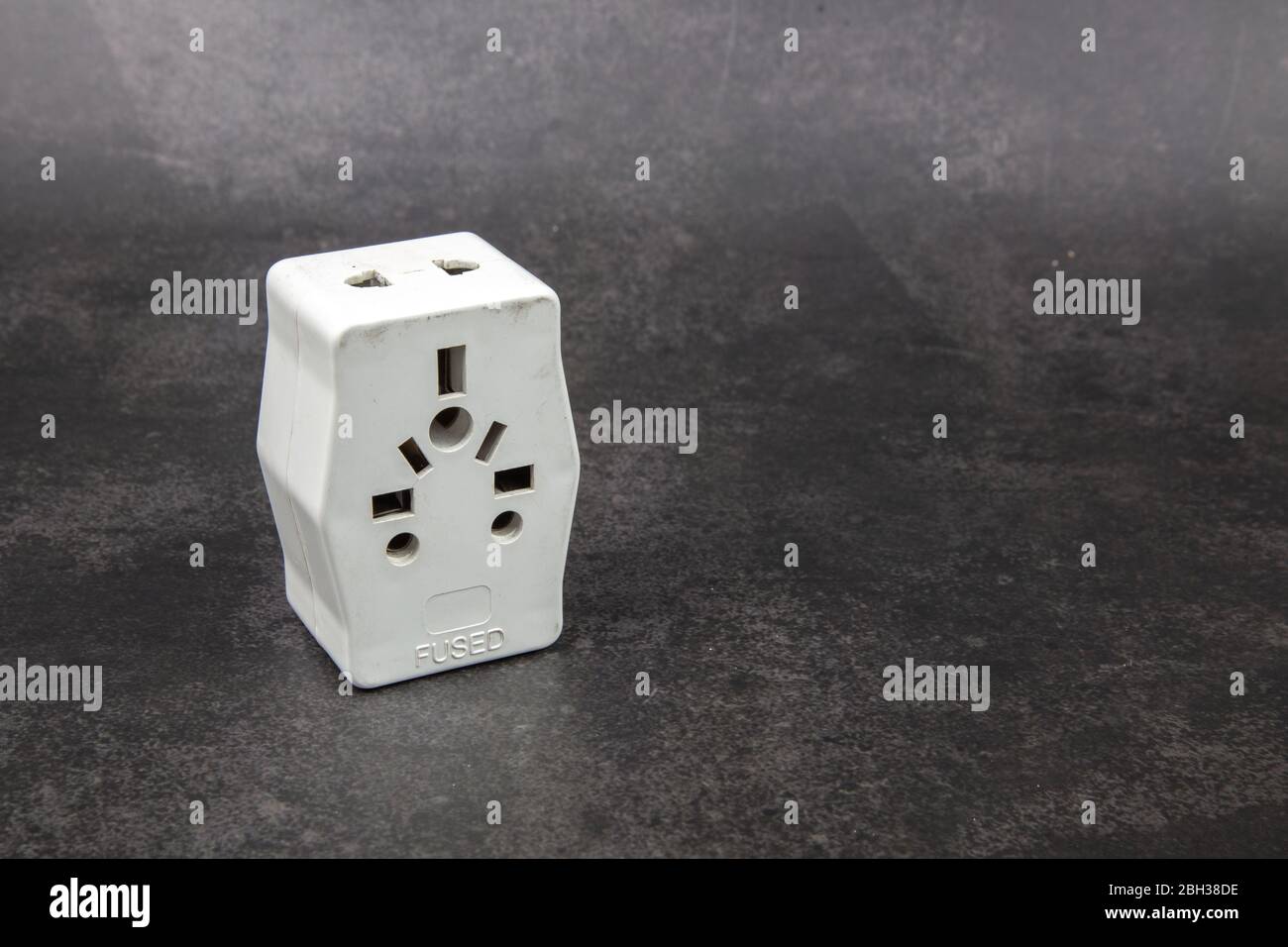 Close up of universal electric multiple socket plug adapters. Used to