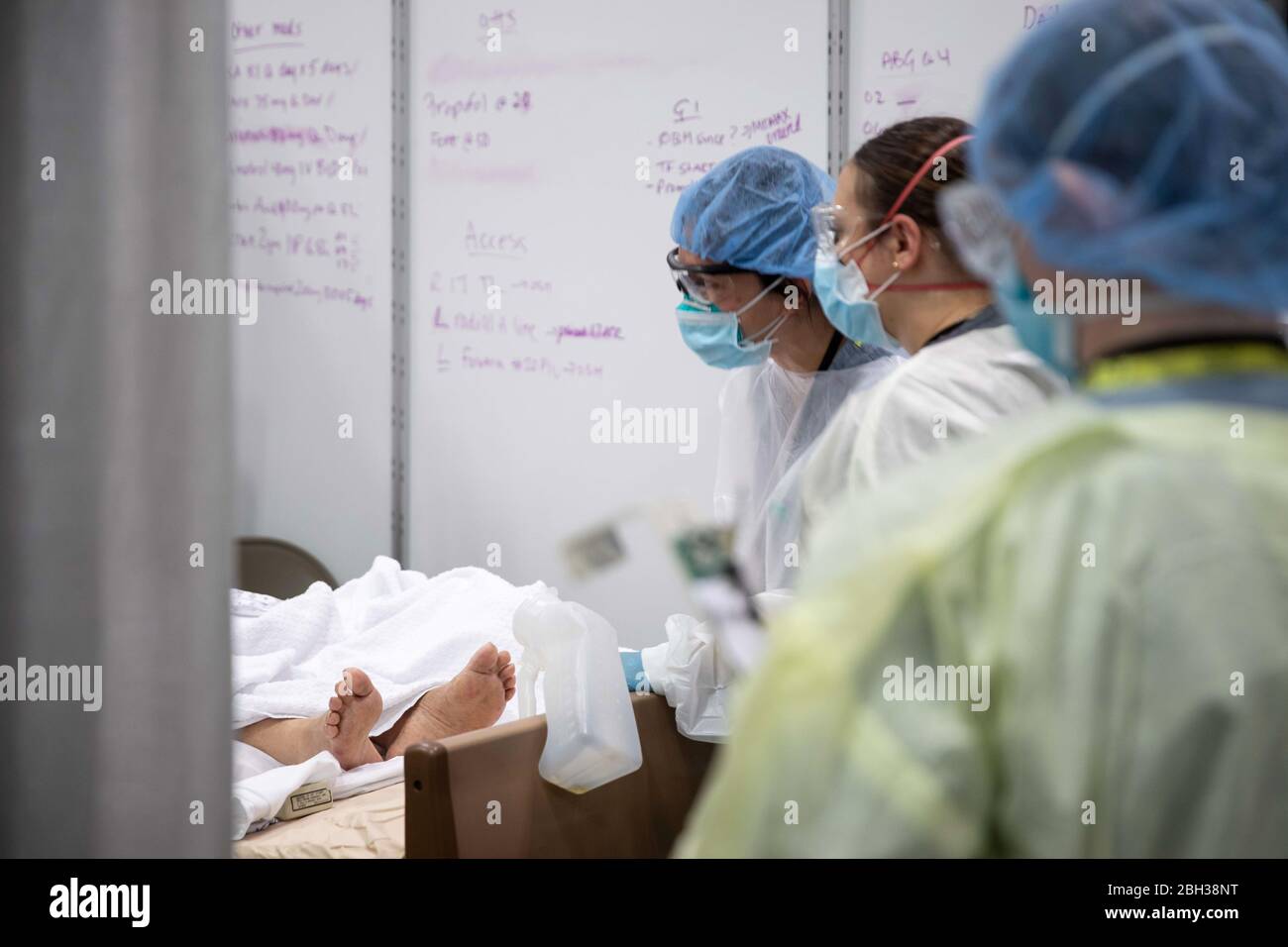 U.S. Army service members, deployed from Fort Campbell, Kentucky, perform patient care in the Intensive Care Unit at the Javits New York Medical Station at the Jacob K. Javits Convention Center in New York City, in support of the Department of Defense COVID-19 response. Stock Photo