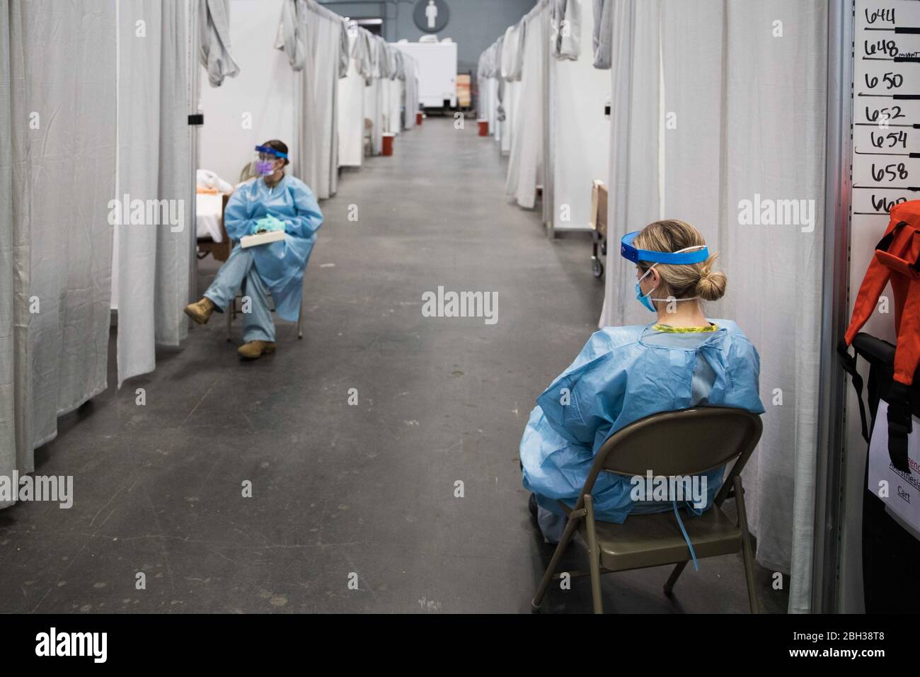 Soldiers assigned to the Javits New York Medical Station (JNYMS) at the Jacob K. Javits Convention Center in New York City monitor COVID-19 patients in the facility’s intensive care unit. Stock Photo
