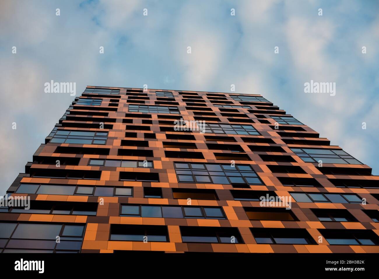 skyscraper with different colors with very unusual windows and shapes ...