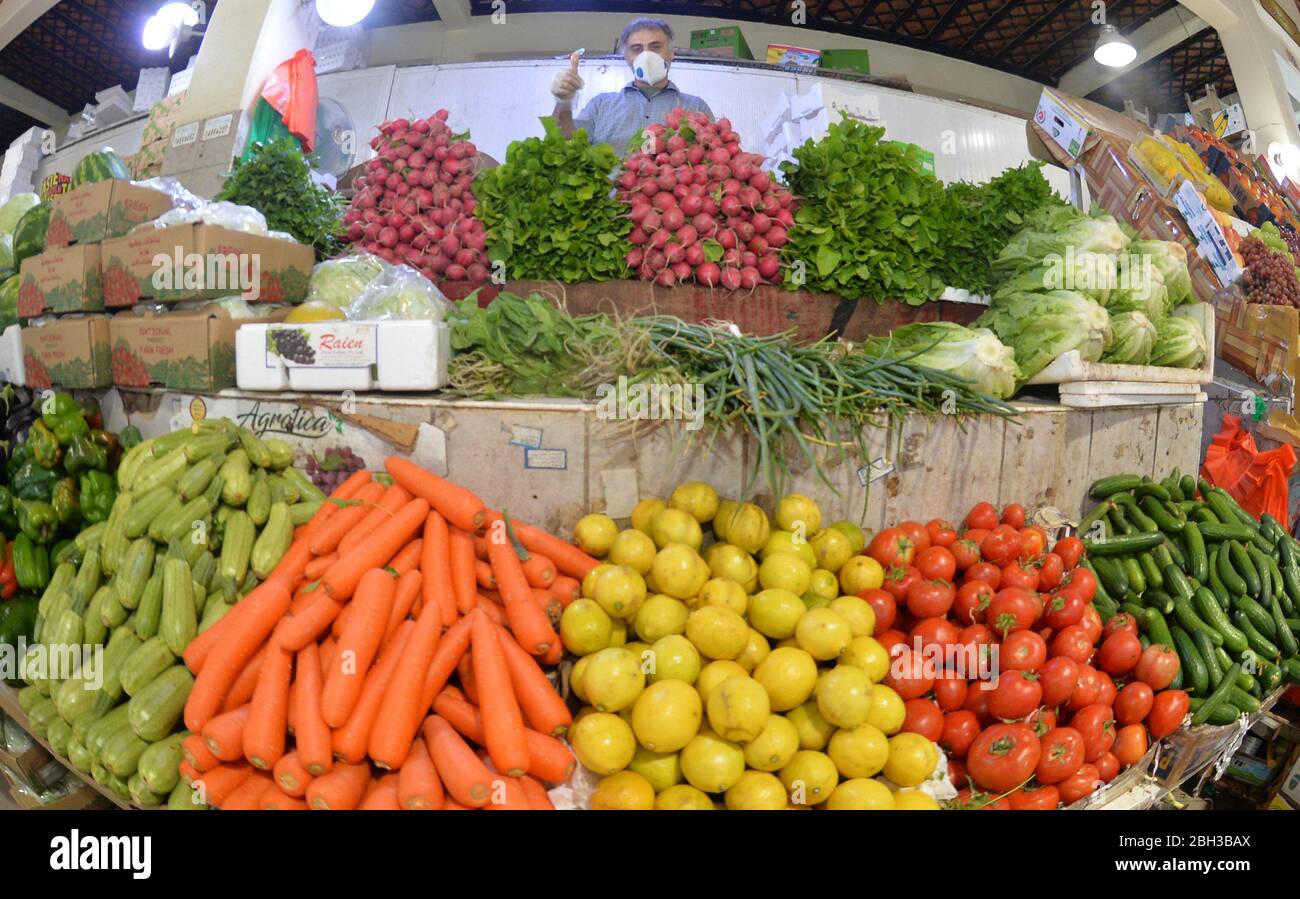 Kuwait City, Kuwait. 22nd Apr, 2020. A vegetable vendor waits for