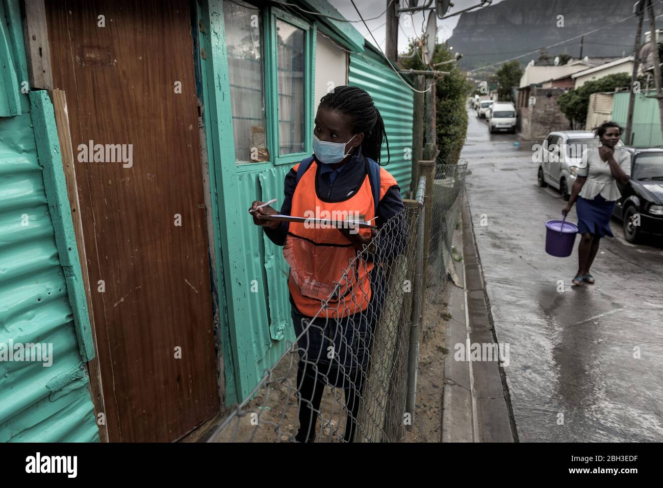 South African health workers screening for coronavirus in the densely populated Hout Bay informal settlement of Imizamo Yethu near Cape Town Stock Photo