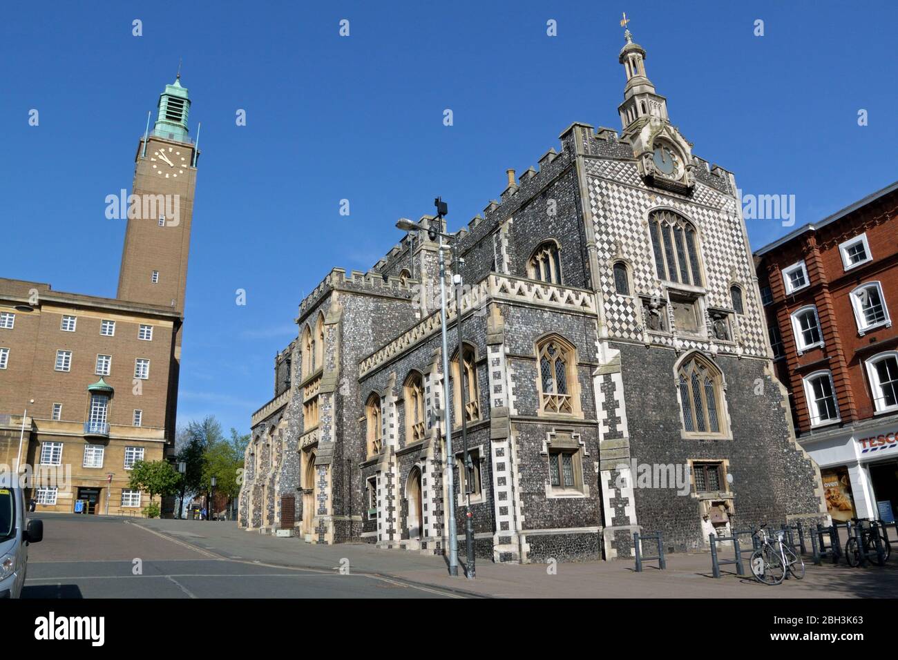 Norwich Guildhall, Norfolk, UK, with the clock tower of City Hall beyond Stock Photo